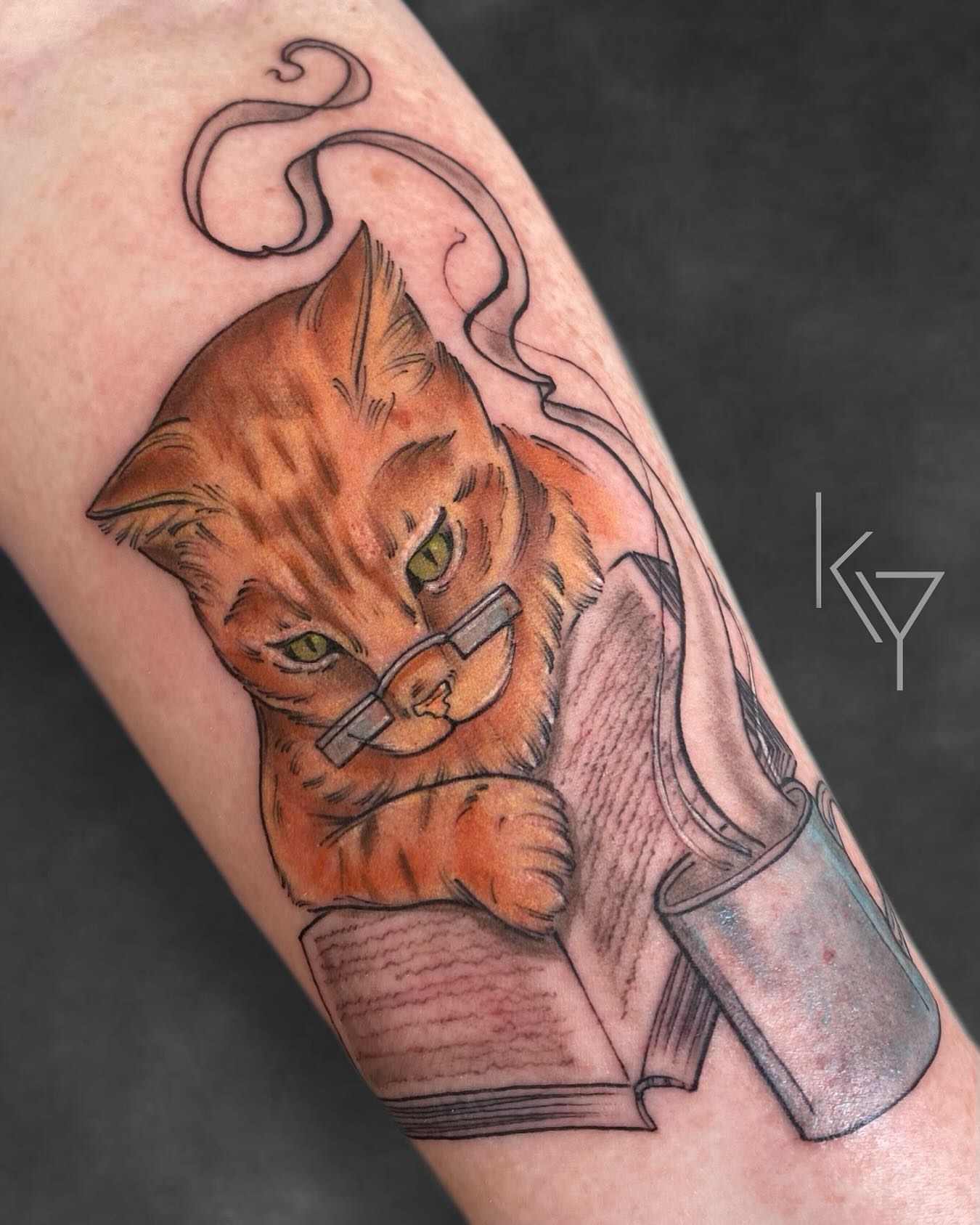 Cat reading realism tattoo on the forearm by ..✨ K I R S T y y O R K ✨..