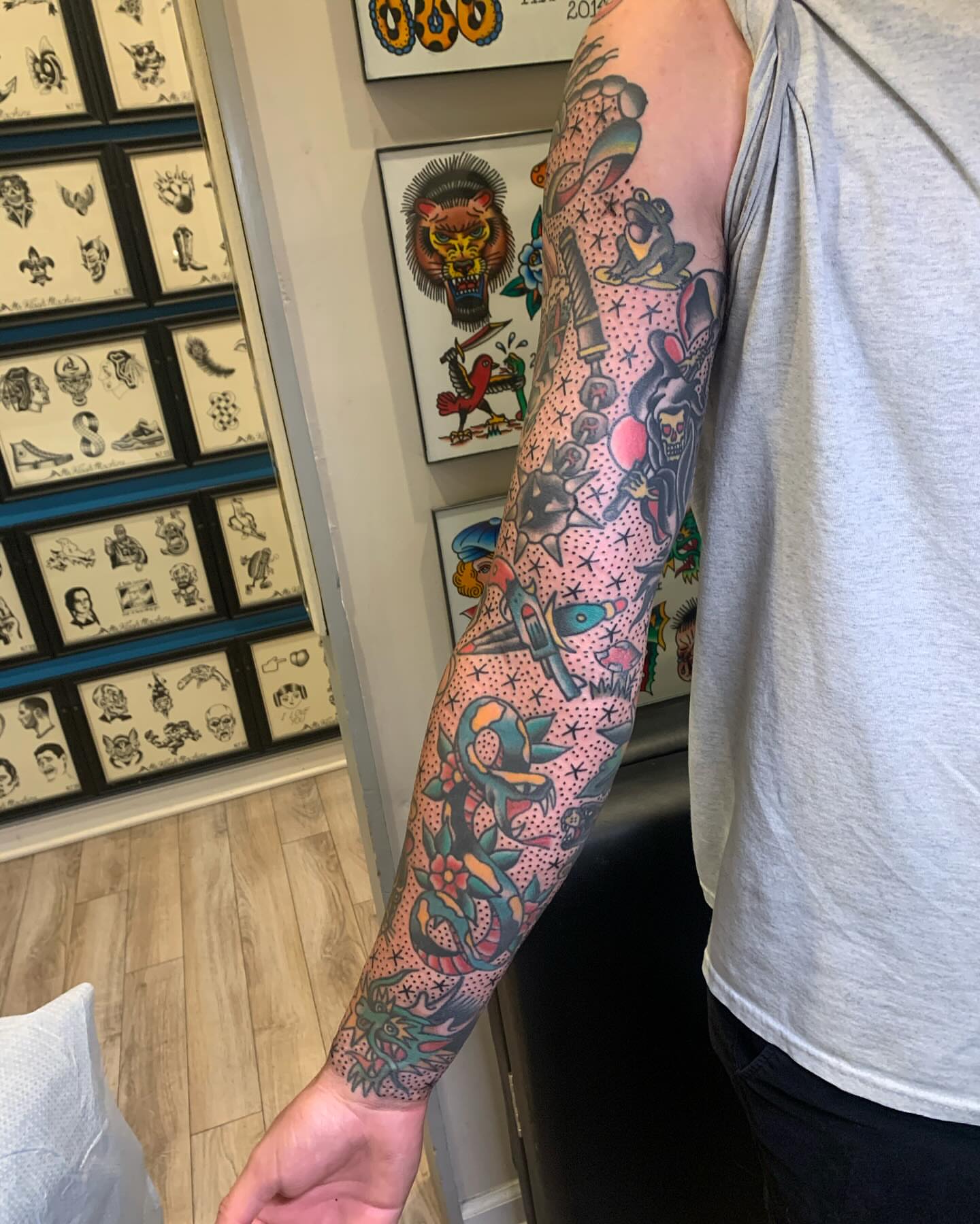 Full sleeve American traditional tattoo on the upper arm by mike_howard