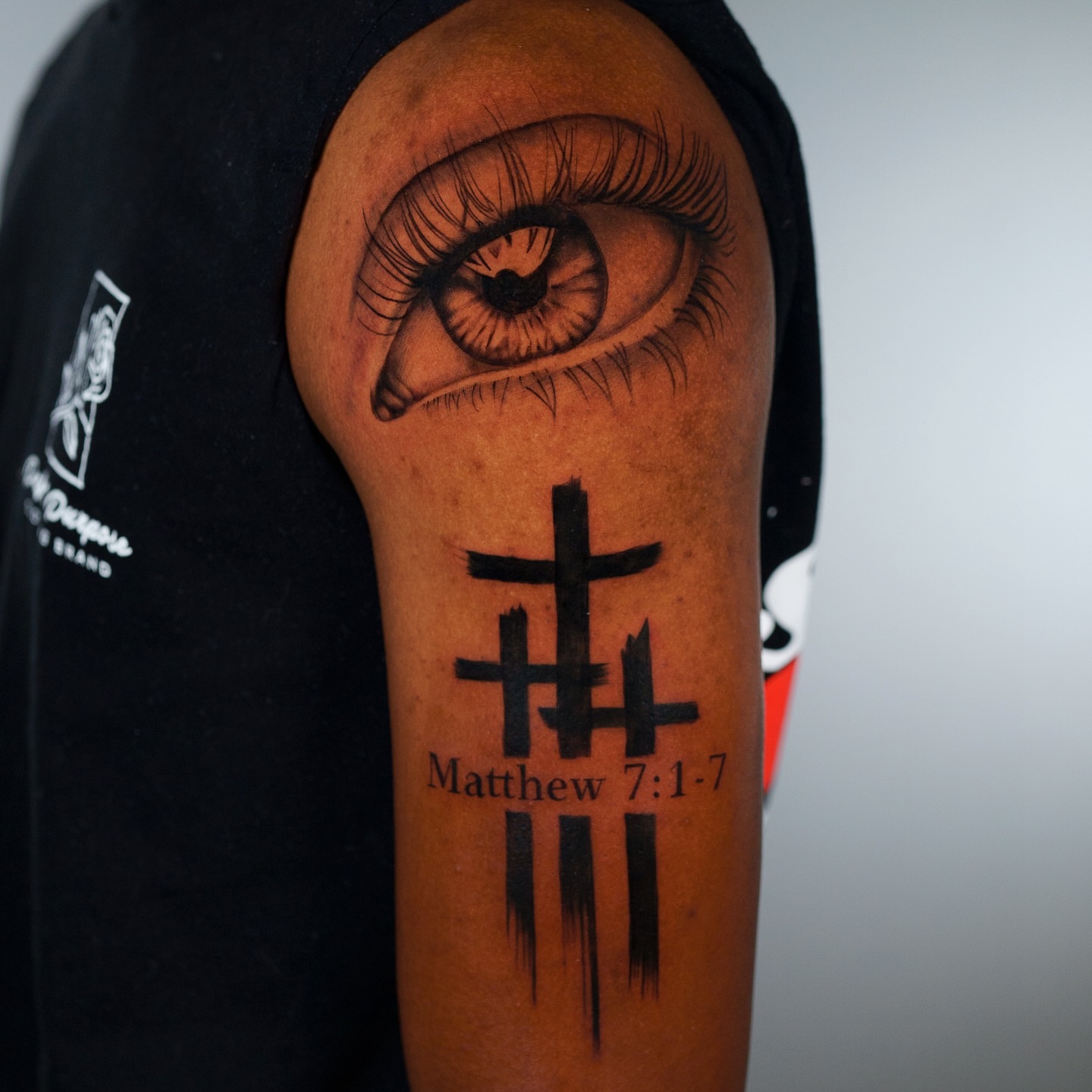 Eye and cross realism tattoo on the forearm by Christopher Heffley