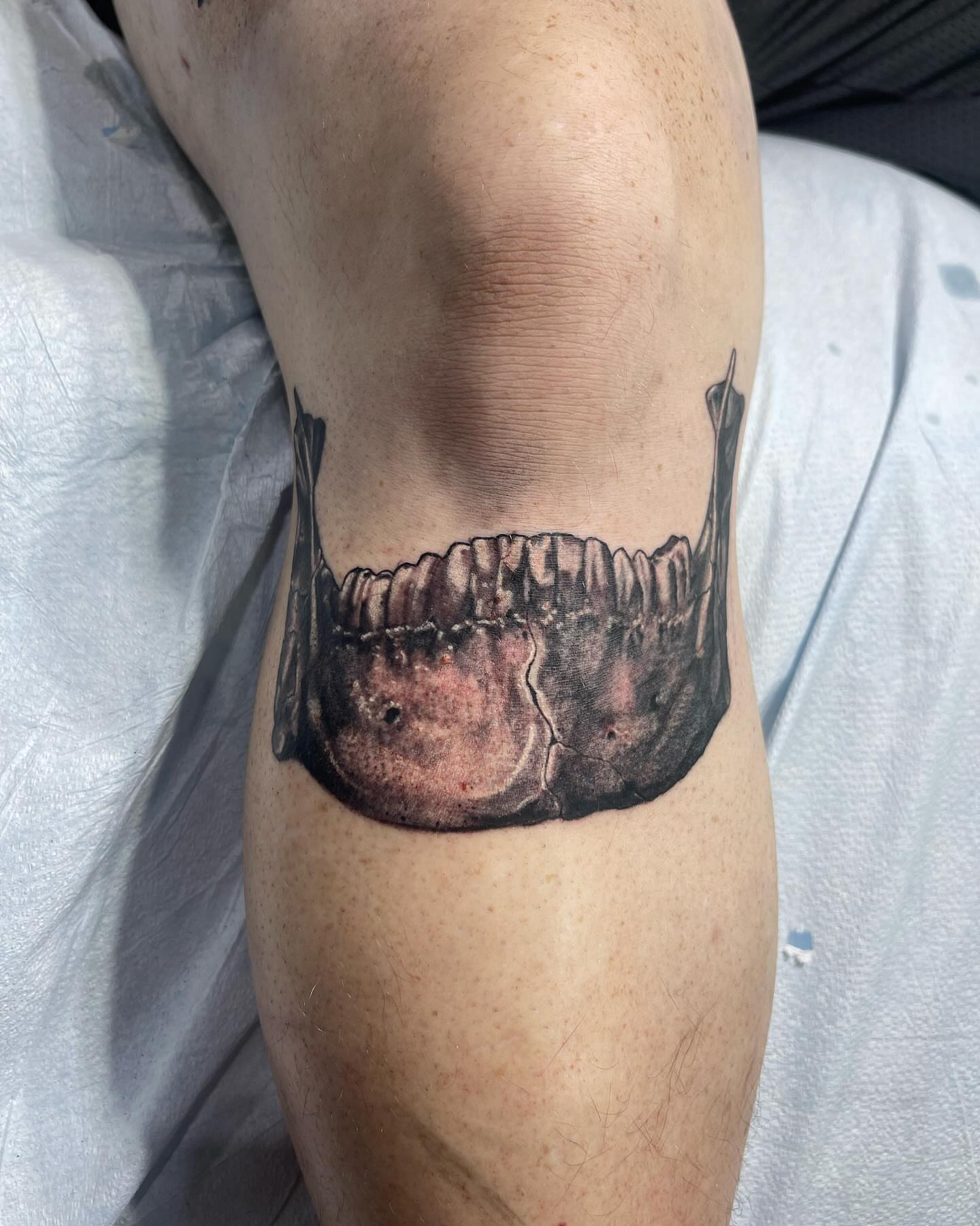 Jawbone realism tattoo on the forearm by Troy Butner