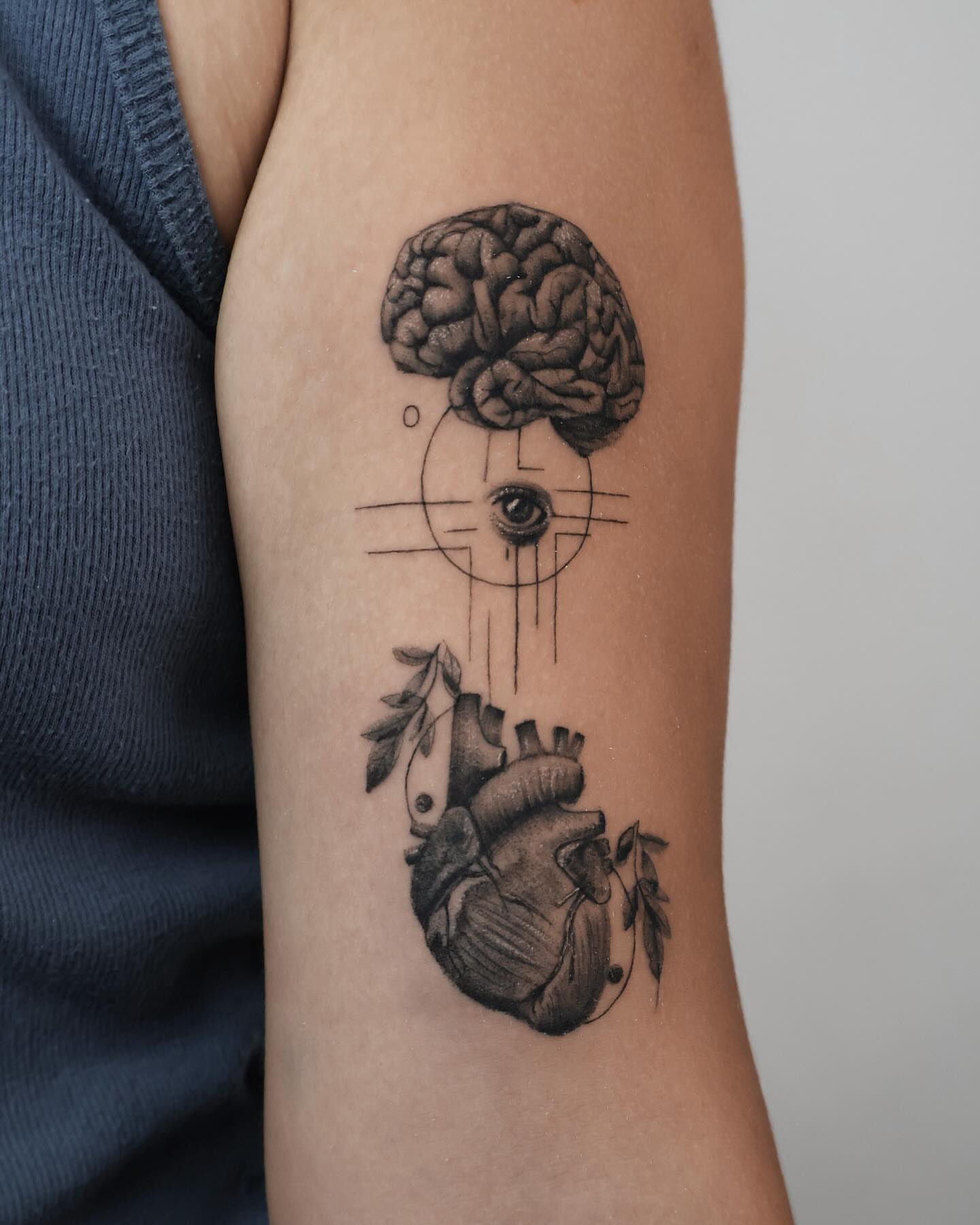 Brain, eye, heart realism tattoo on the forearm by Stephanie Pedraza