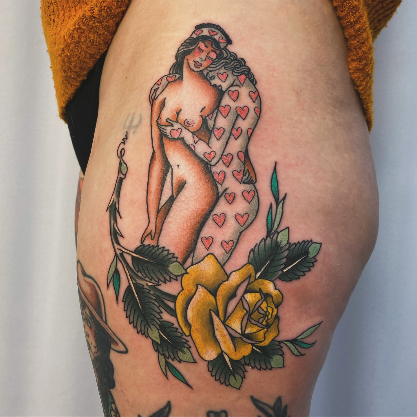 Nude woman with hearts American traditional tattoo on the thigh by Adam Bailey, Portland, Oregon