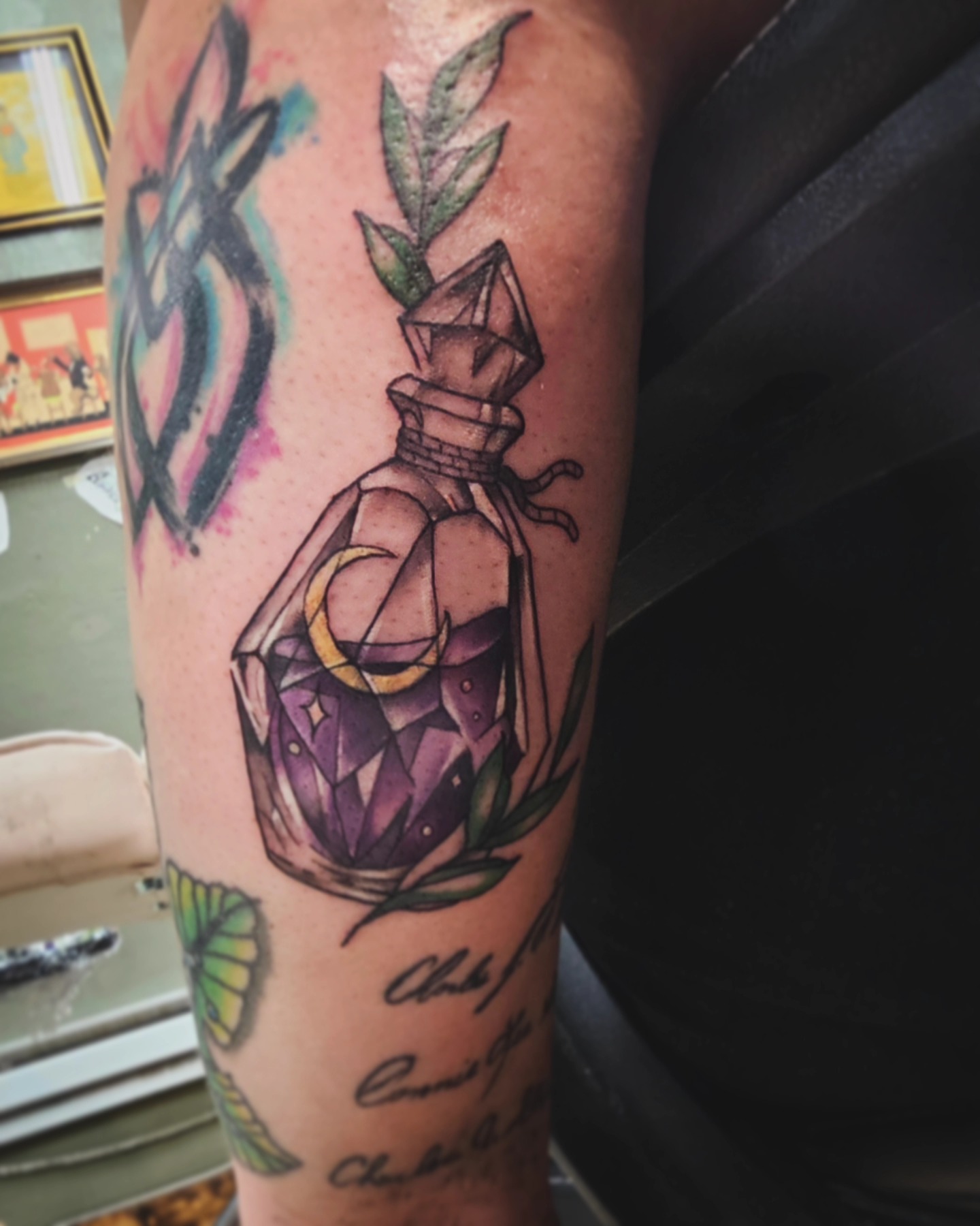 Gemstone bottle geometric tattoo on the forearm by Nadine ☥