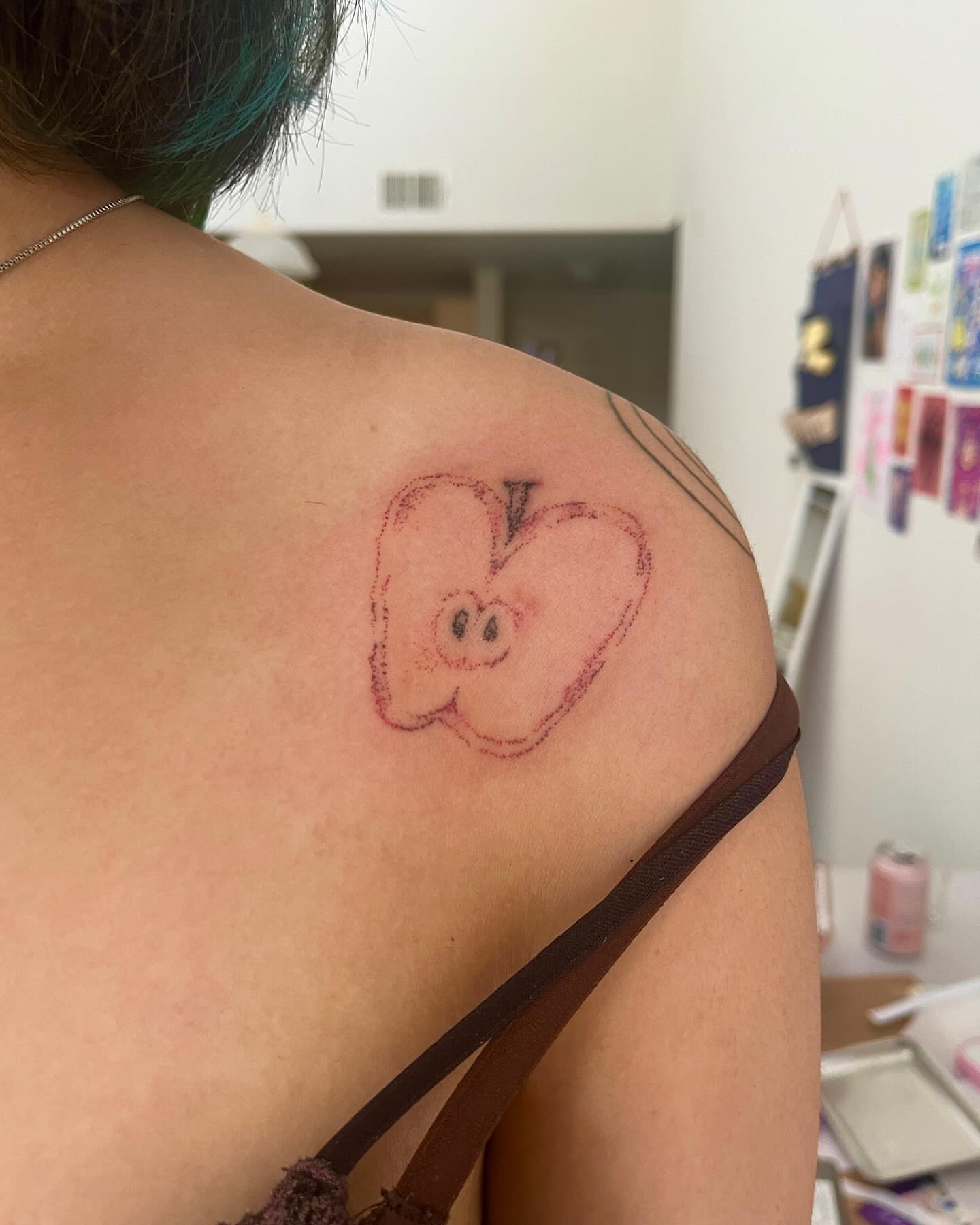Apple dotwork tattoo on the shoulder by hana