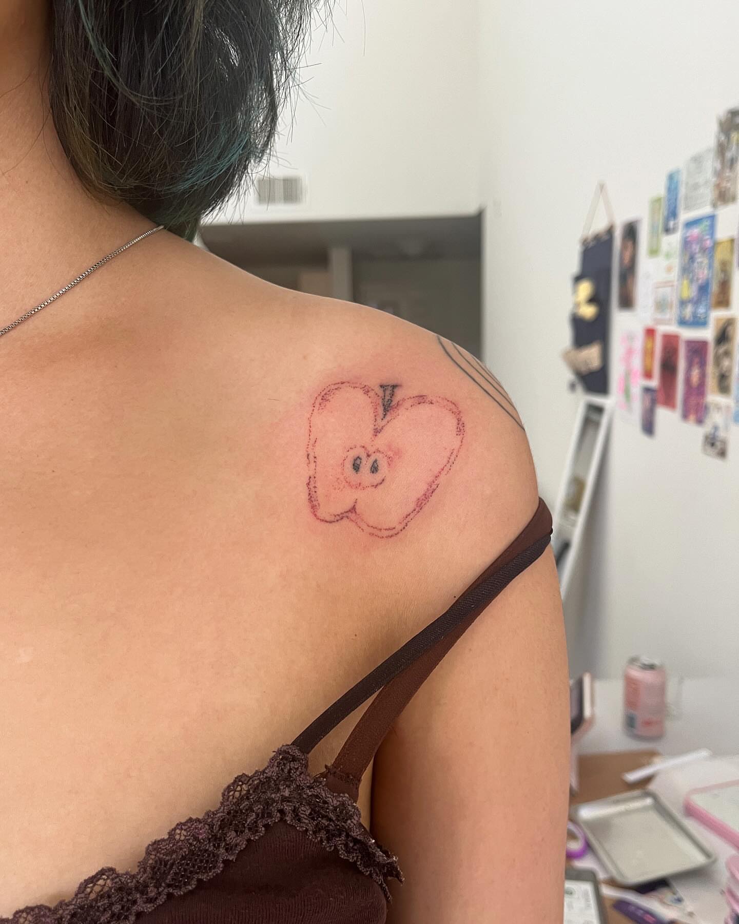 Apple dotwork tattoo on the shoulder by hana