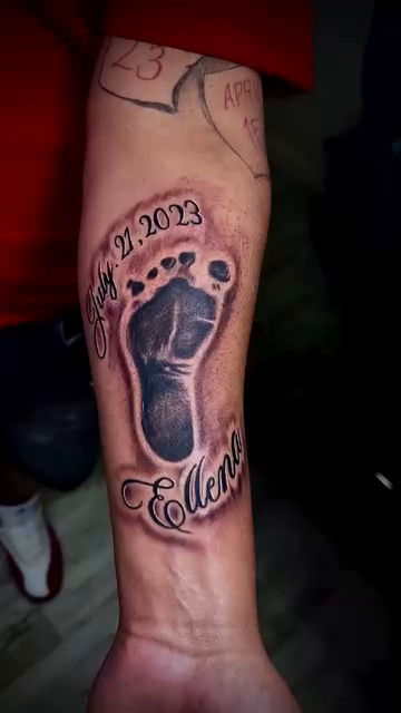 Baby footprints with name and date realism tattoo on the forearm by Luis Cabrera, Cleveland, Ohio