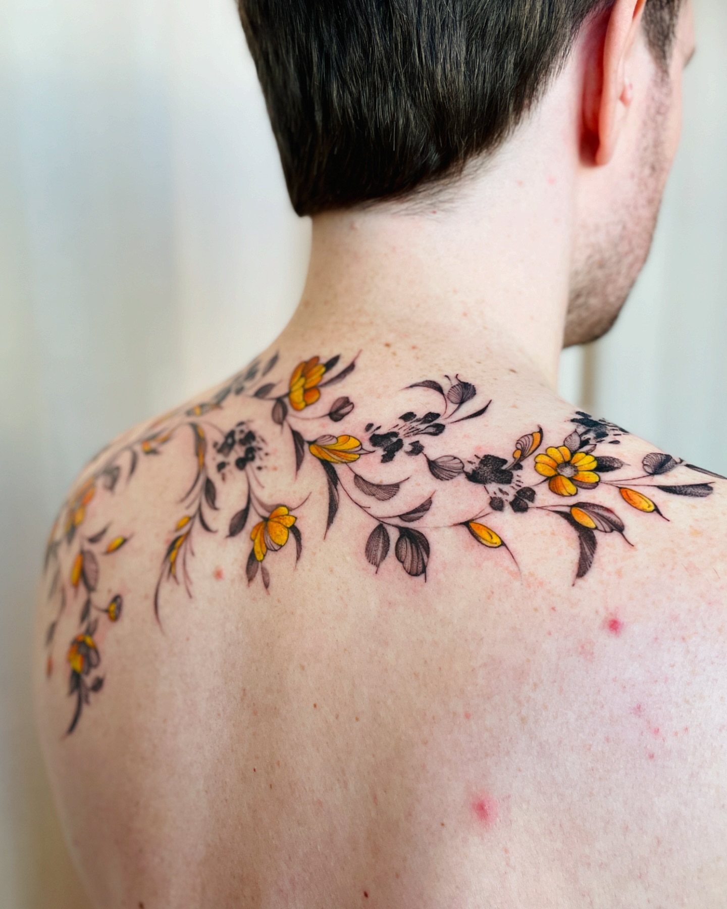 Floral arrangement new school tattoo on the shoulder by Dung Ngo