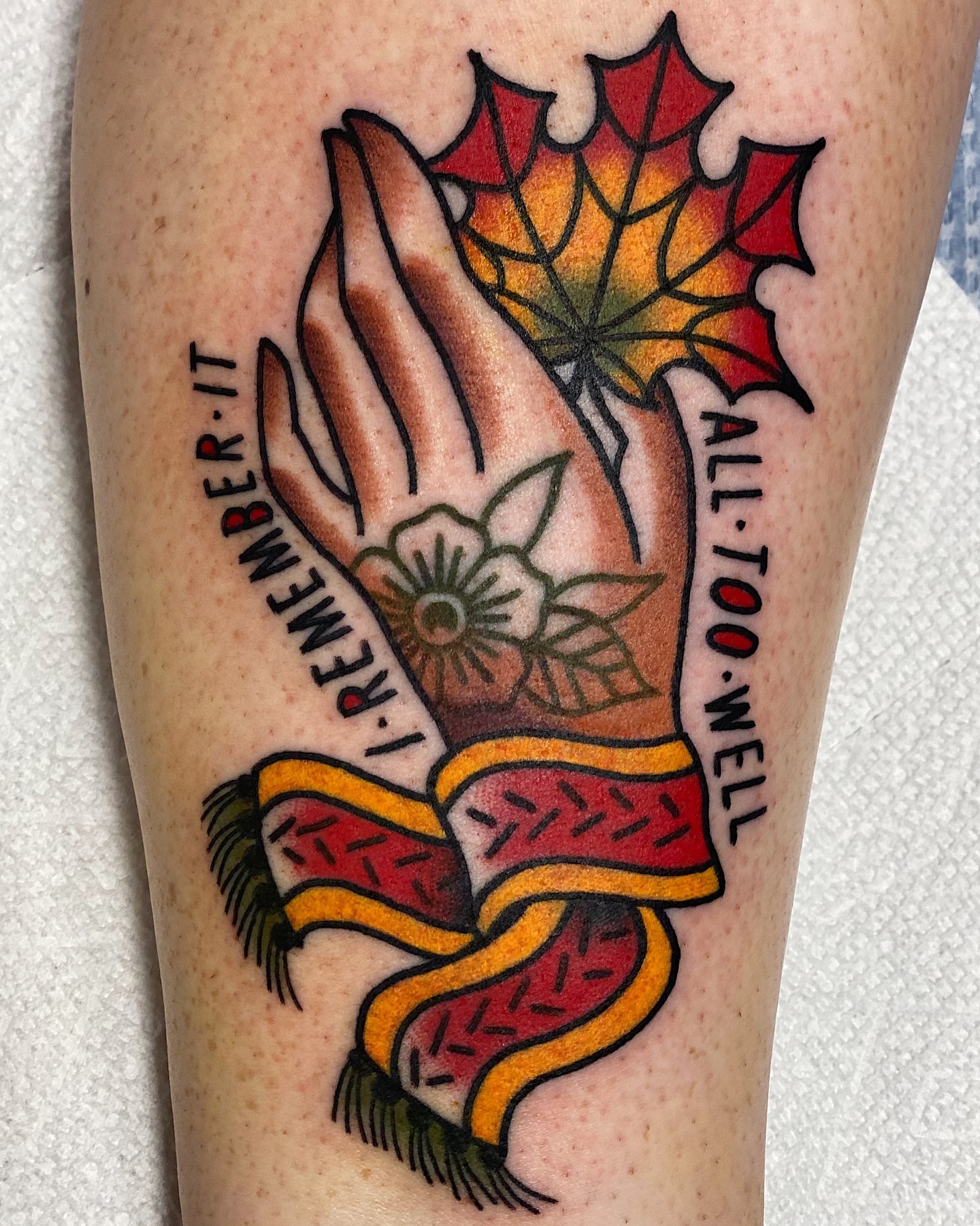 Praying hands with spiderweb American traditional tattoo on the forearm by Dakota Amato