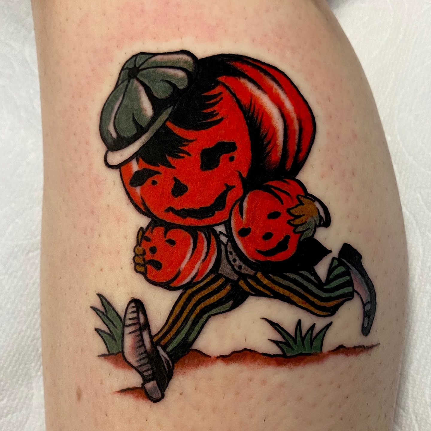 Pumpkin boy American traditional tattoo on the forearm by Haley Tucker, Sebastopol, California