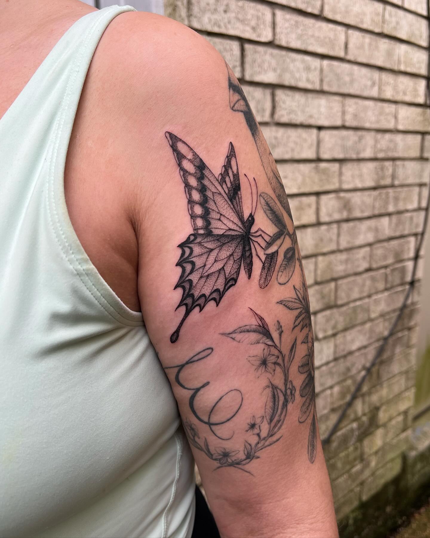 Butterfly black and grey tattoo on the forearm by Natasha