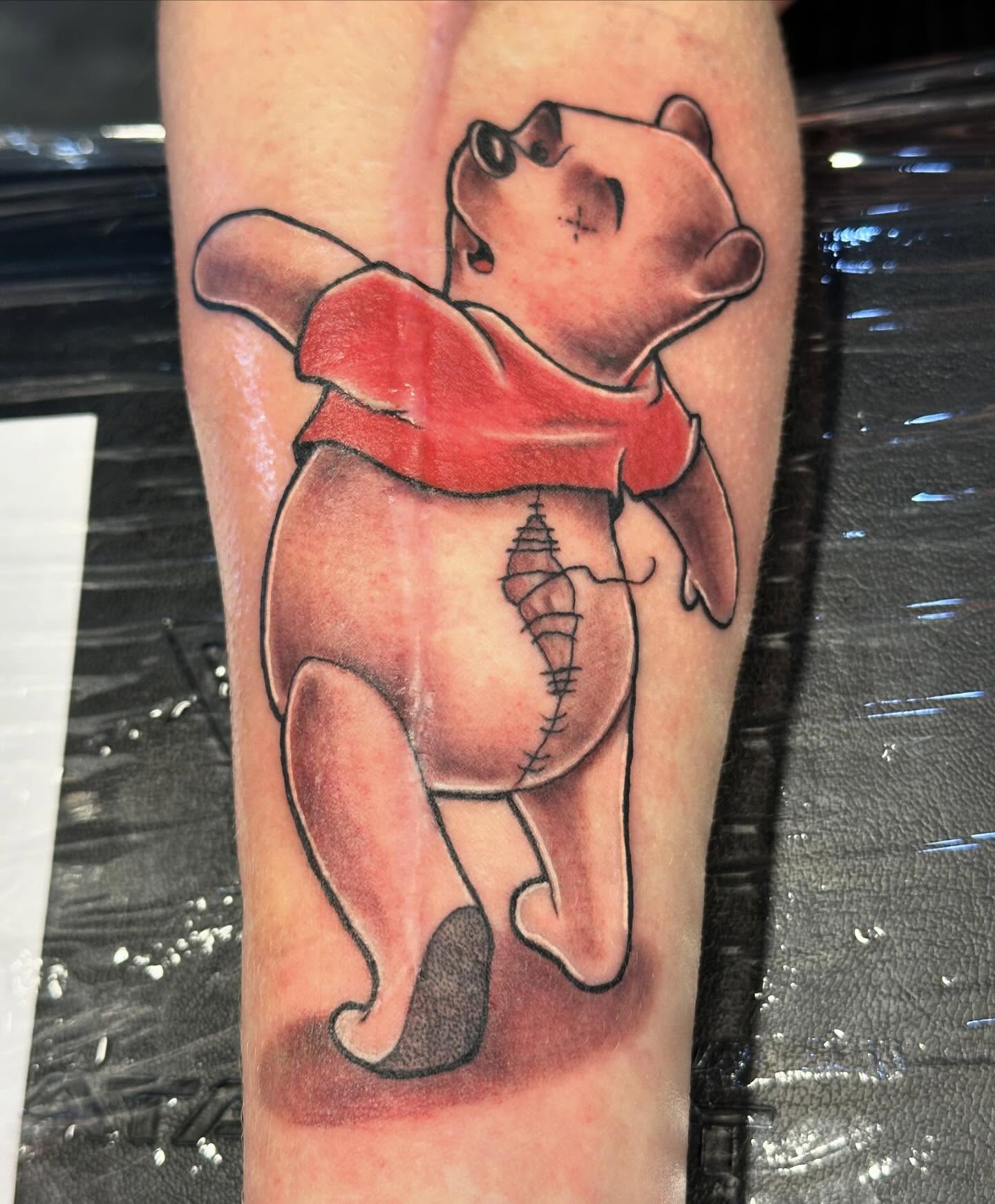 Winnie the Pooh realism tattoo on the forearm by Svetlana