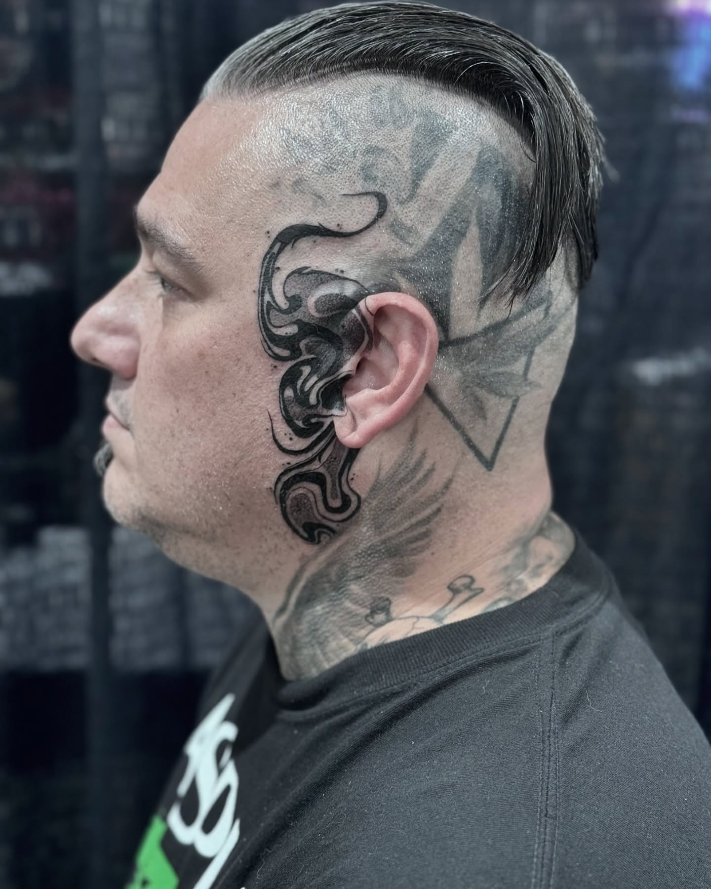 Flame black and grey tattoo on the head by Jymi Calkins