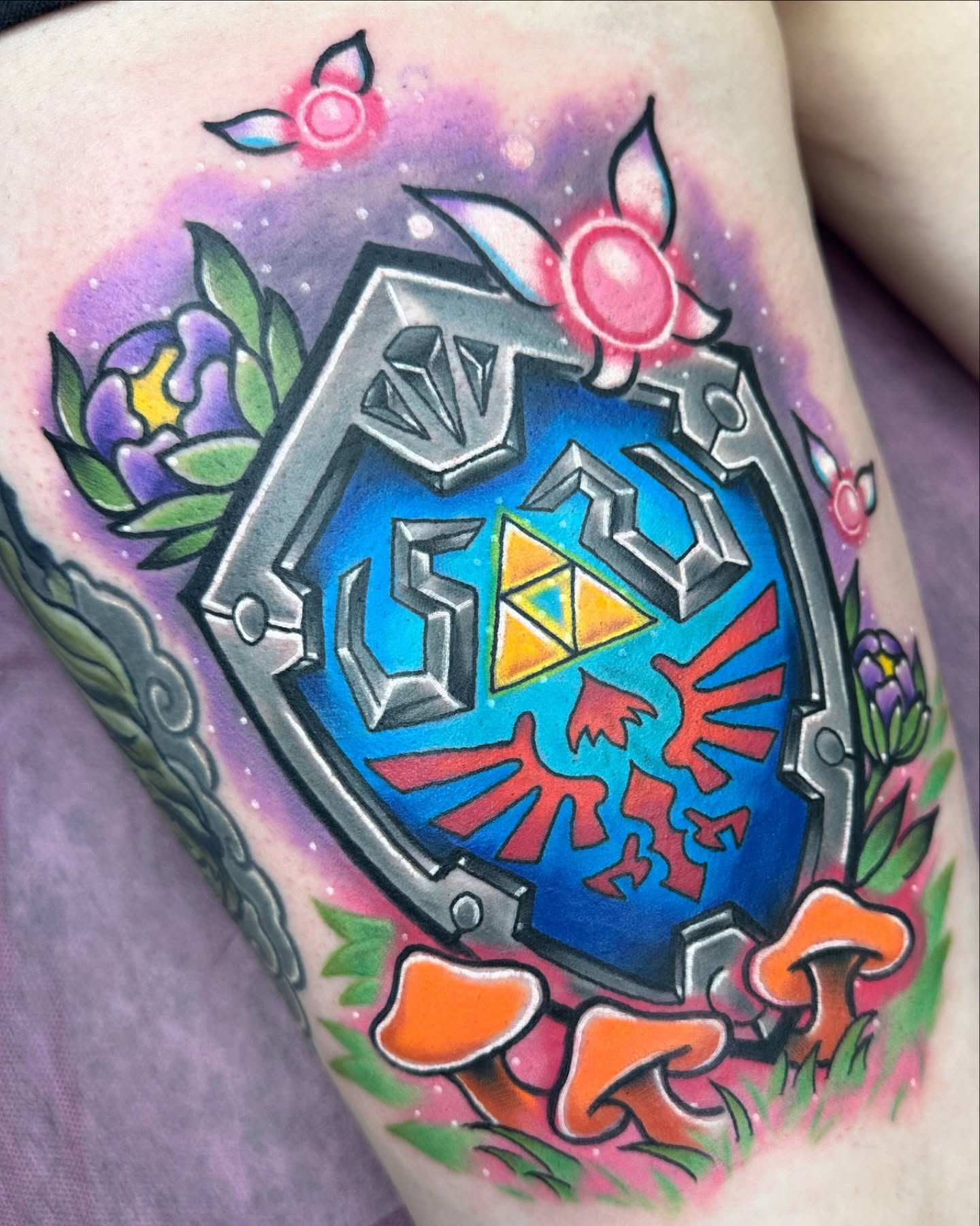 Hylian Shield new school tattoo on the thigh by Jeremy Thomas
