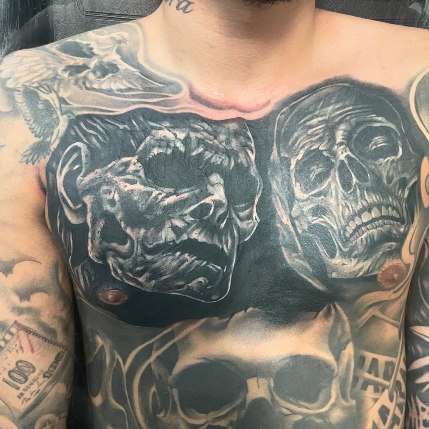 Skulls realism tattoo on the chest by payaso
