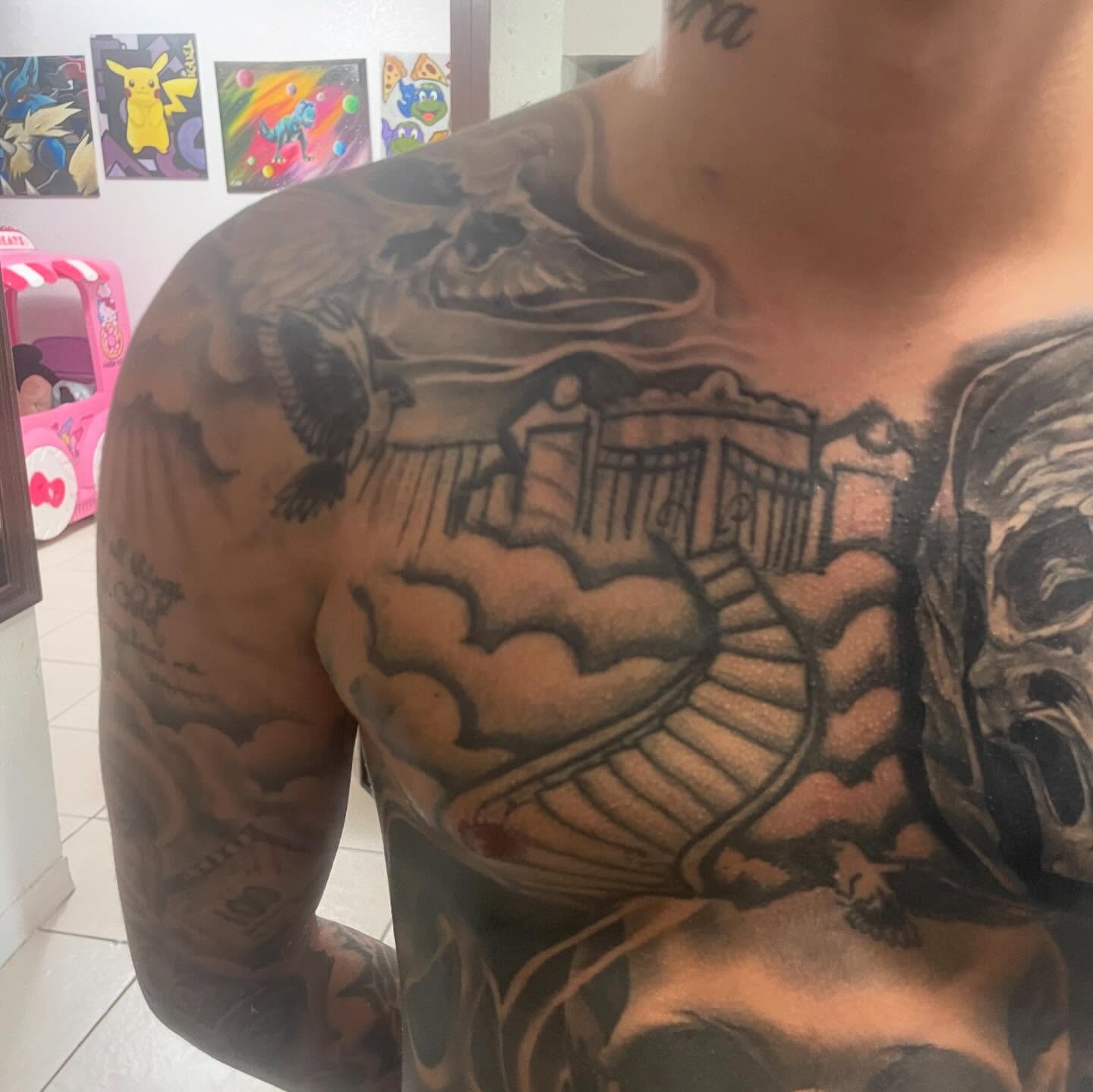 Ship and clouds black and grey tattoo on the chest by payaso