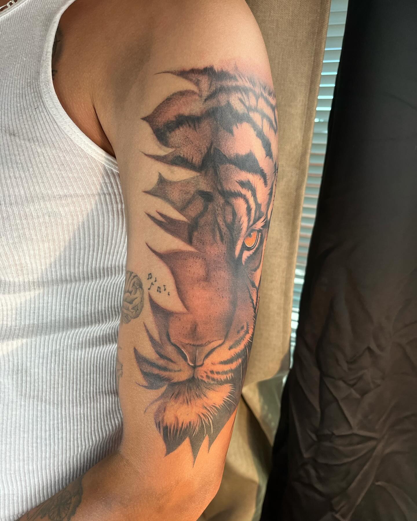 Tiger realism tattoo on the forearm by Denver Tattoo Artist