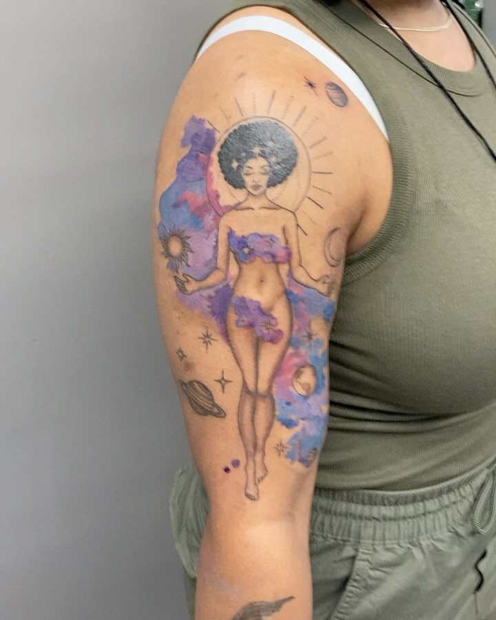 Space goddess watercolor tattoo on the upper arm by Detroit Tattoo Artist