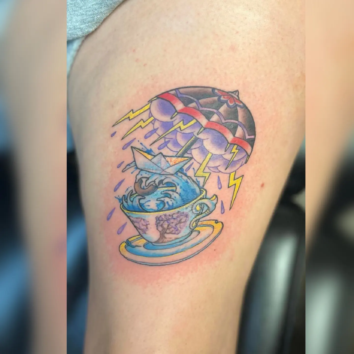 Storm in a teacup new school tattoo on the forearm by Nason Dilts
