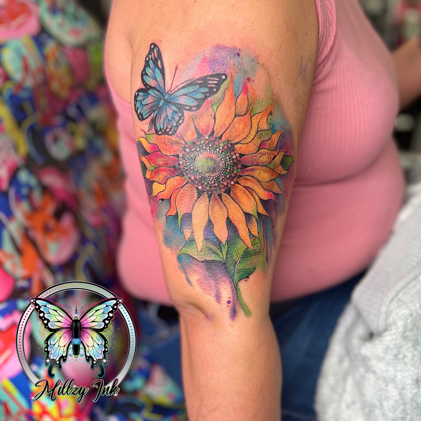 Sunflower and butterfly watercolor tattoo on the upper arm by Your Virginia Tattoo Bestie🫶🏽