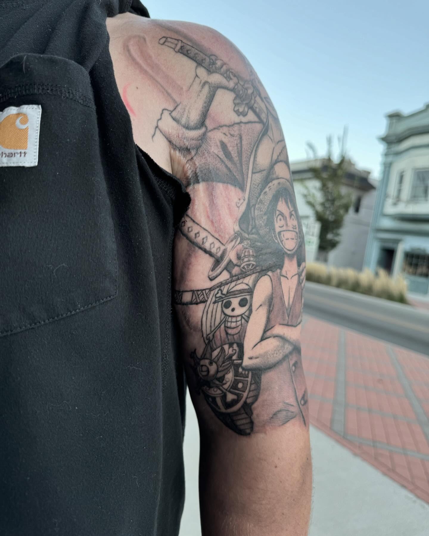 Pirate ship and characters realism tattoo on the shoulder by Kyle J. Bishop