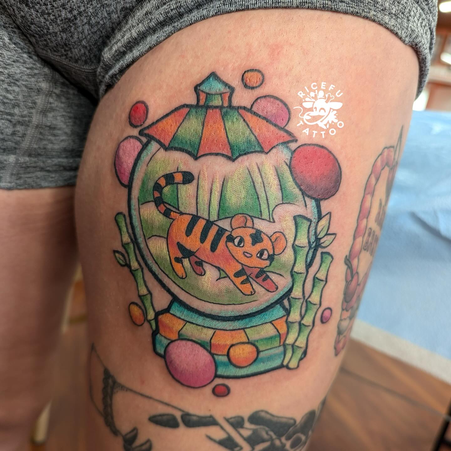 Tiger in a lantern new school tattoo on the thigh by Ricefu Art & Tattoo