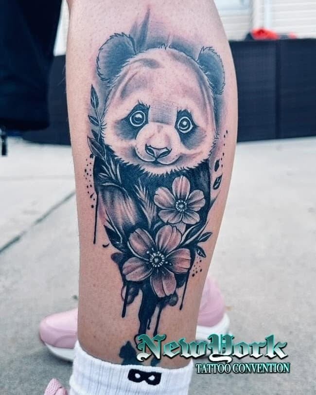 Panda and flowers realism tattoo on the calf by jersey ink tattoos, Elizabeth, New Jersey