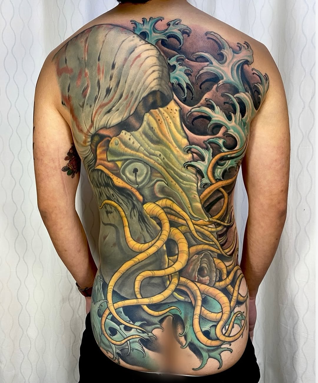Octopus and waves back piece Japanese tattoo on the back by Ty Pallotta, Austin, Texas