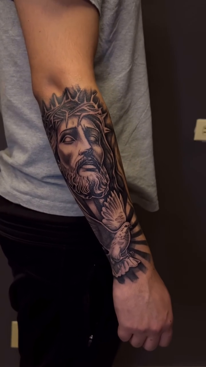 Jesus Christ and dove realism tattoo by Hugo Ruiz-Esparza