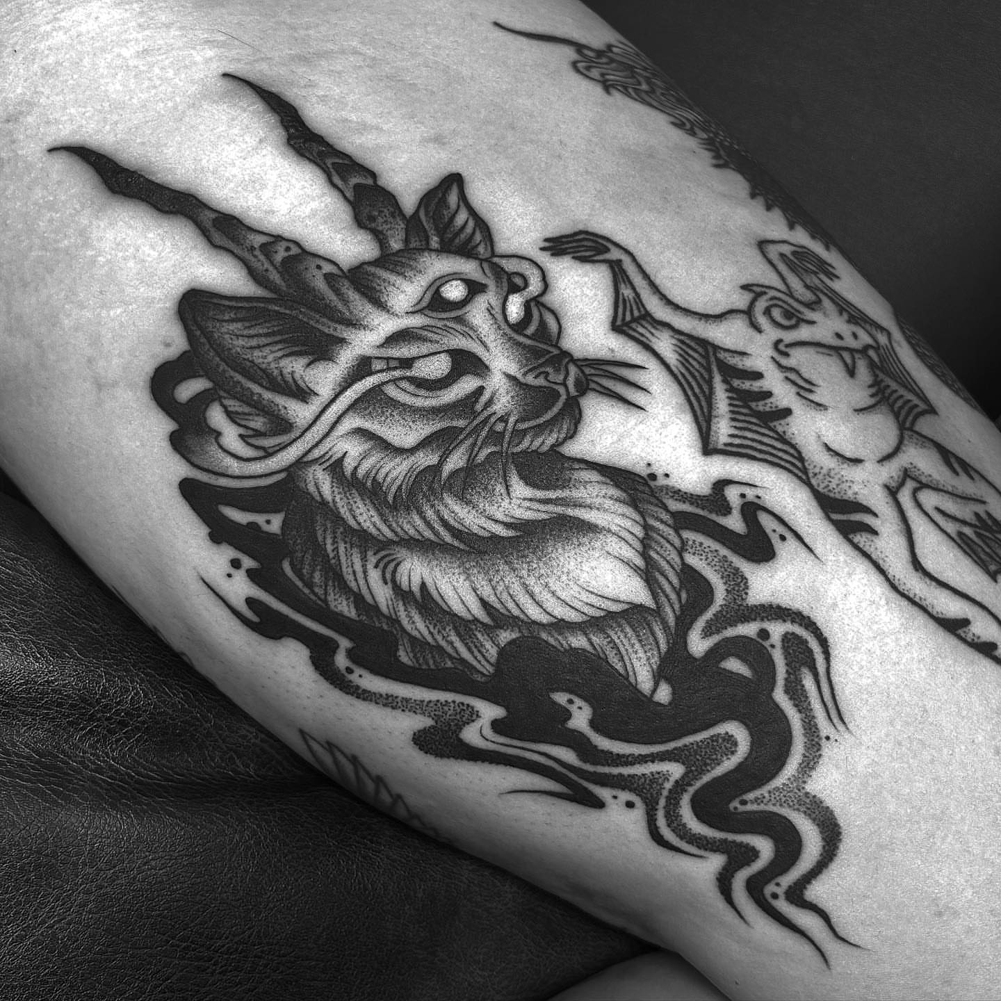 Goat head dotwork tattoo on the thigh by Anna Nicole Thomas