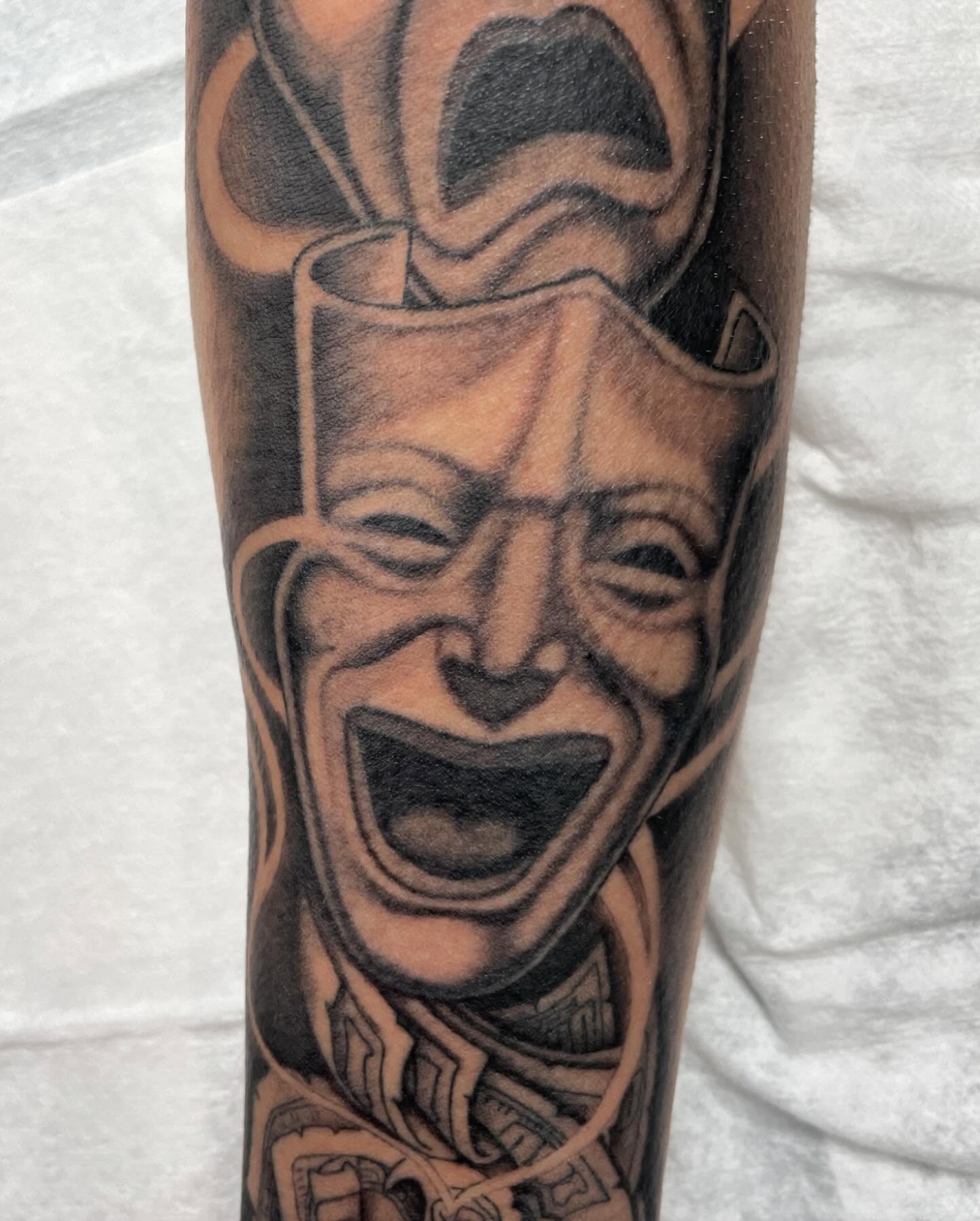 Clown face black and grey tattoo on the forearm by Moses (Mo) 🇵🇭