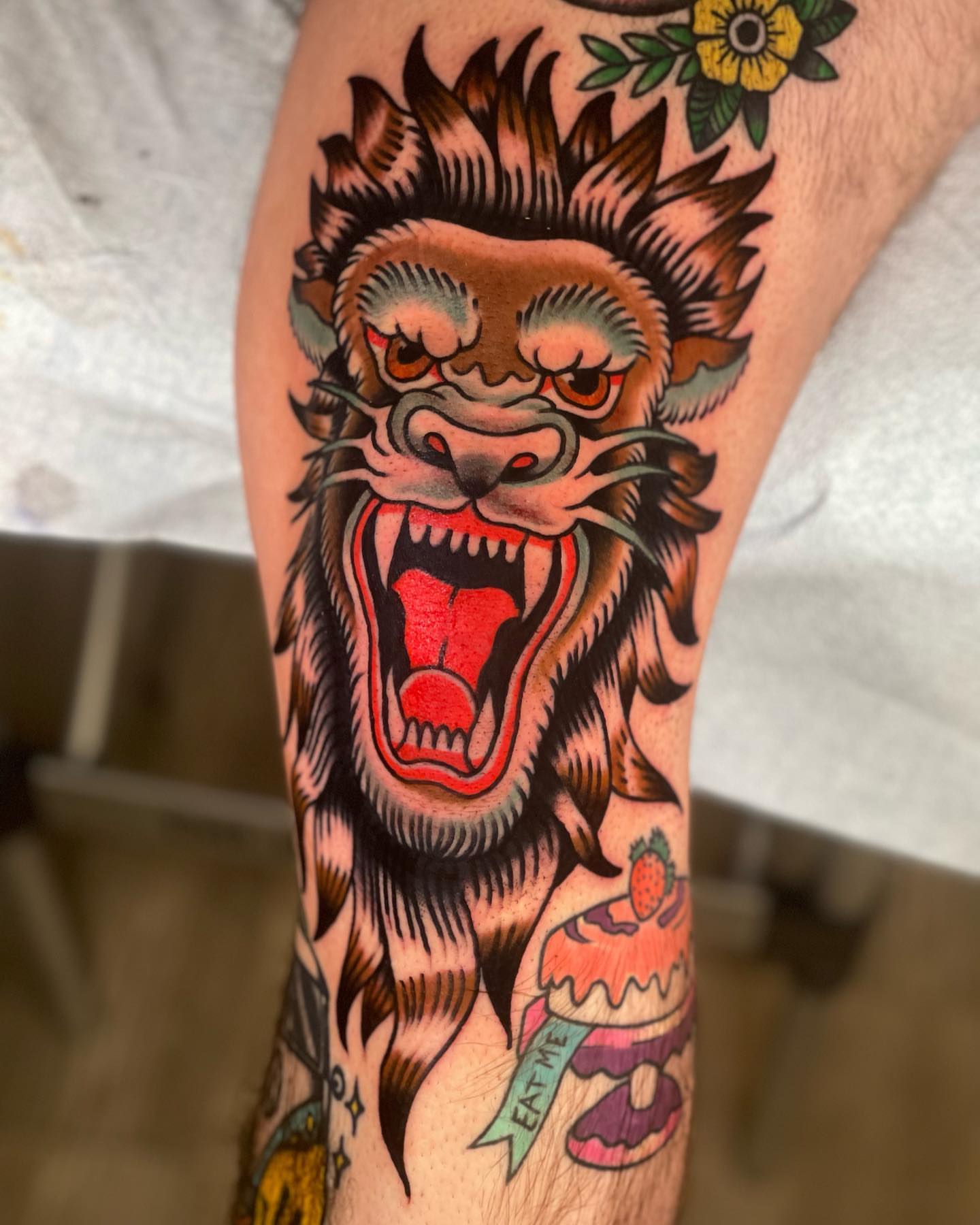 Lion head American traditional tattoo on the forearm by Jeff Miller philly traditional tattoo