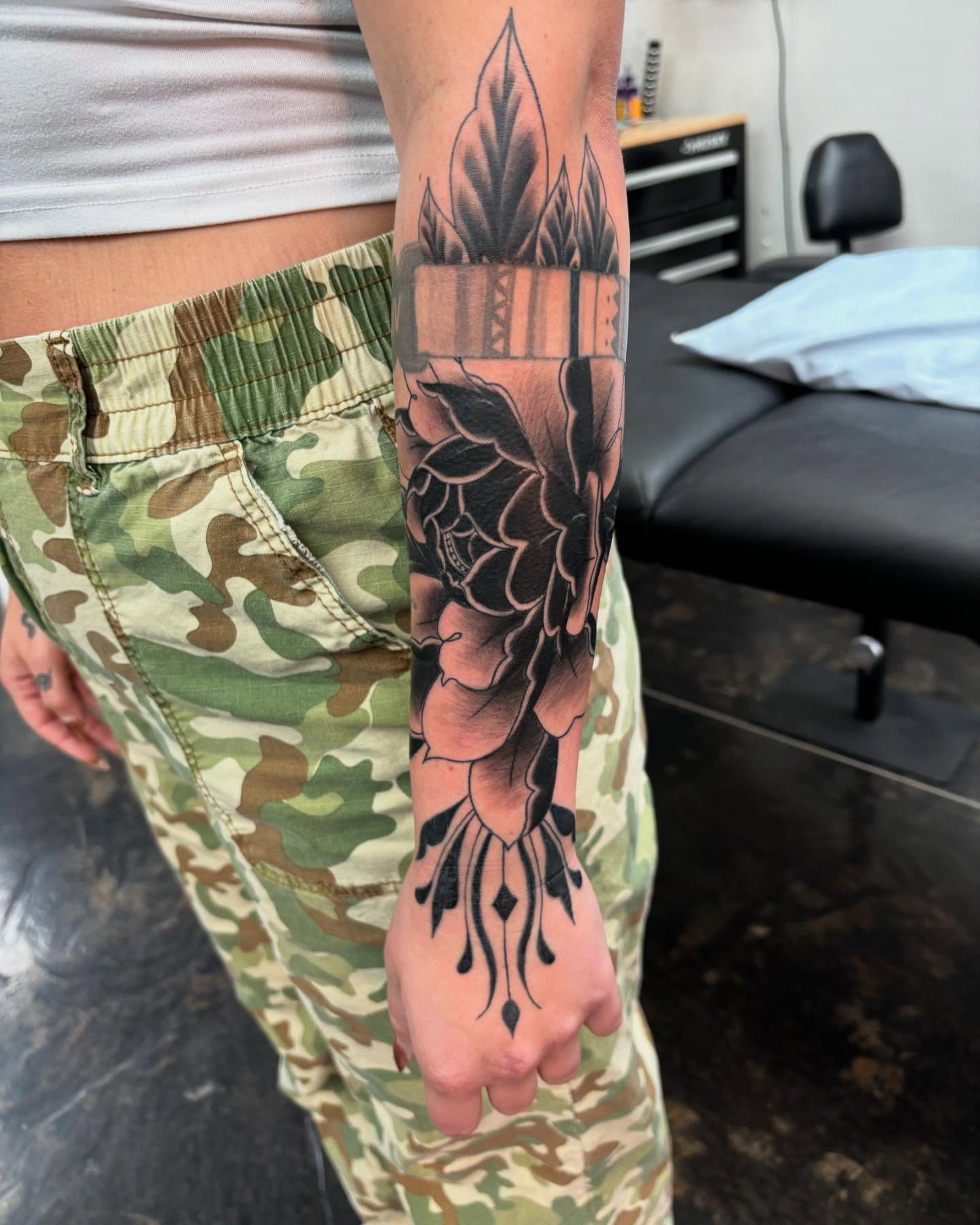 Floral bouquet American traditional tattoo on the forearm by @seibastattoos, Virginia Beach, Virginia