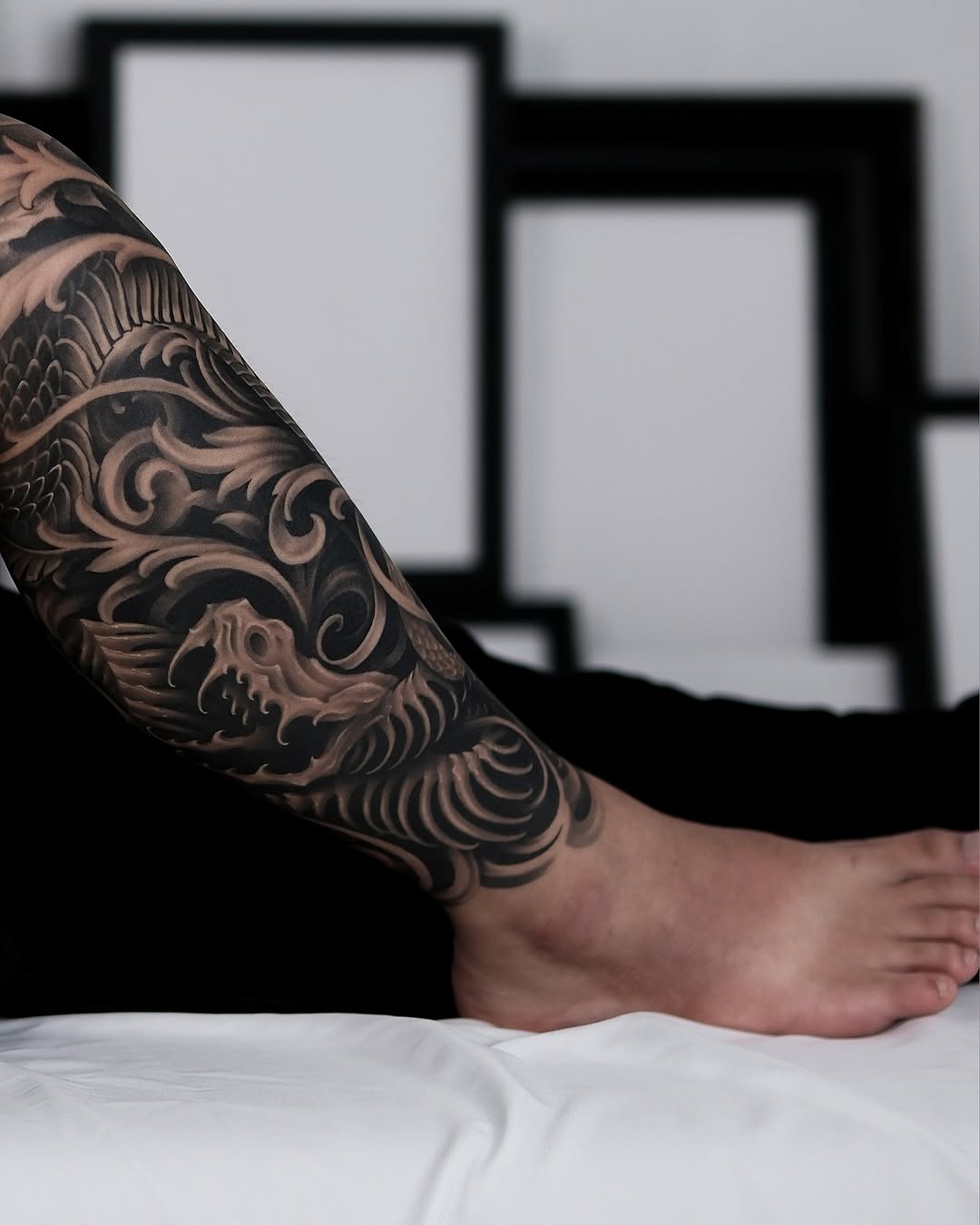 Dragon and waves Japanese tattoo on the forearm by Yujin Ju