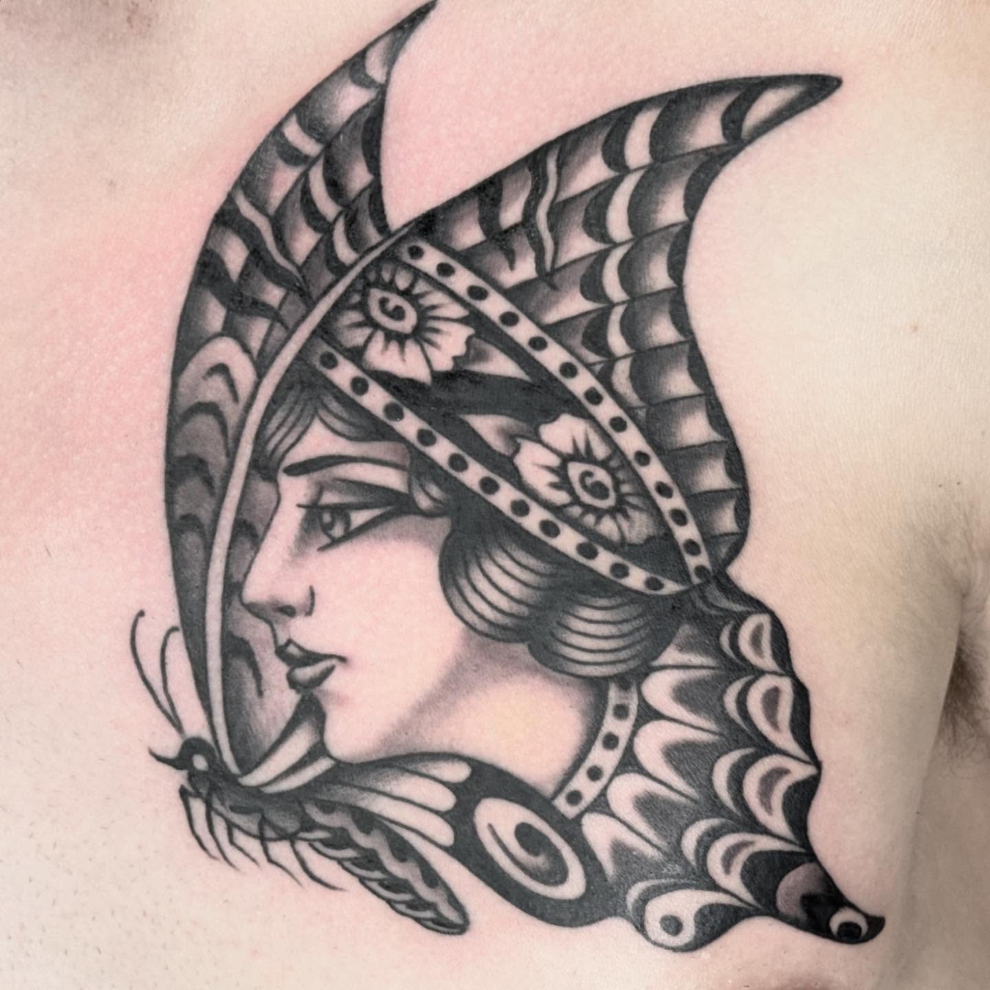 Woman with headdress black and grey tattoo on the shoulder by Sean McMahon