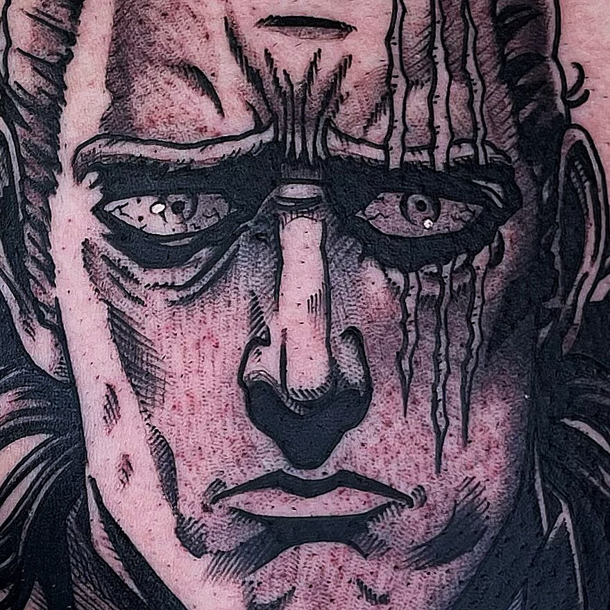 Man's face dark realism tattoo on the head by Bold Anime Tattoos