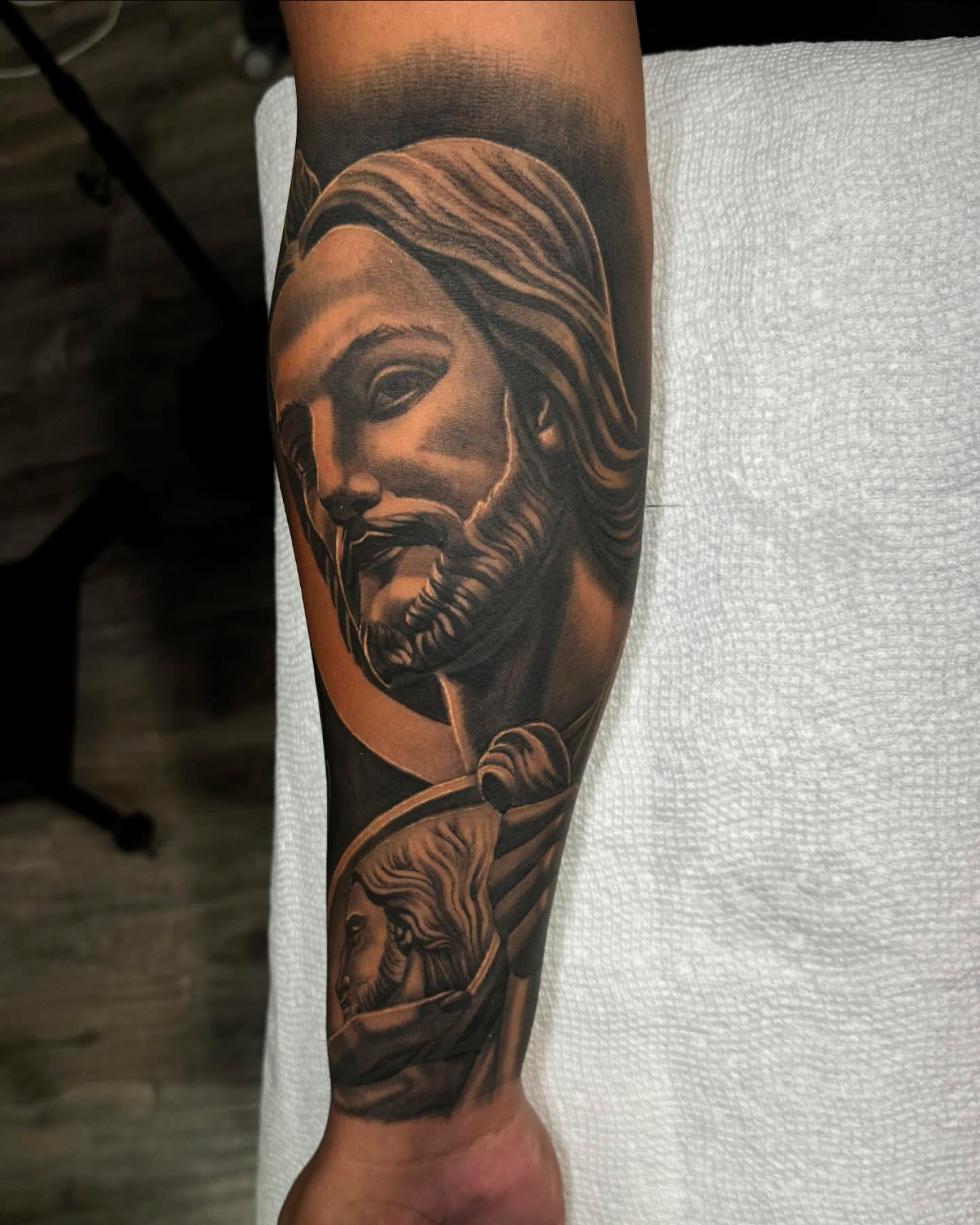 Religious figure realism tattoo on the forearm by Anthony Duran