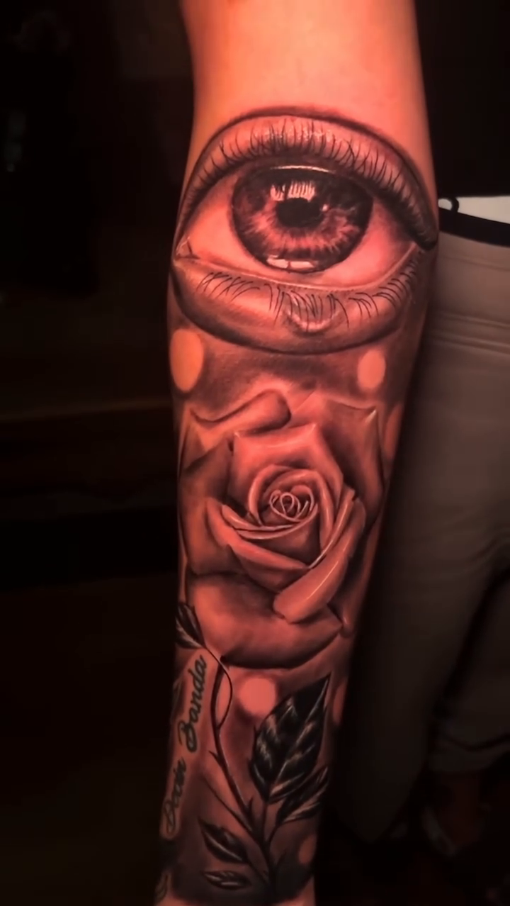 Eye and rose realism tattoo by Jacob Martin, Toledo, Ohio