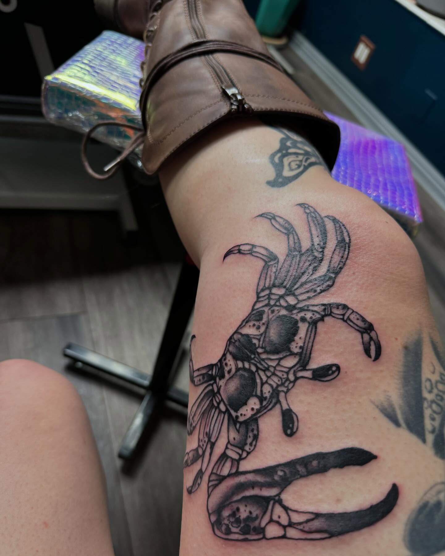 Crab black and grey tattoo on the forearm by Robyn Mahon