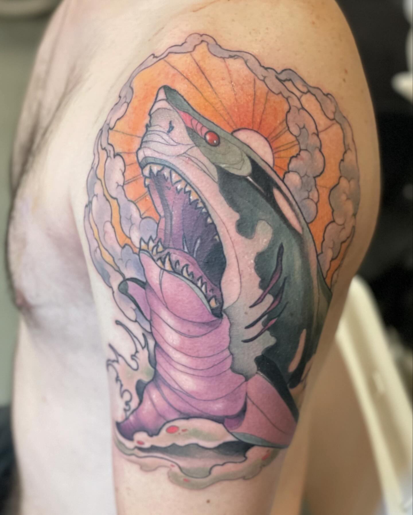 Shark American traditional tattoo on the shoulder by Nathan Evans