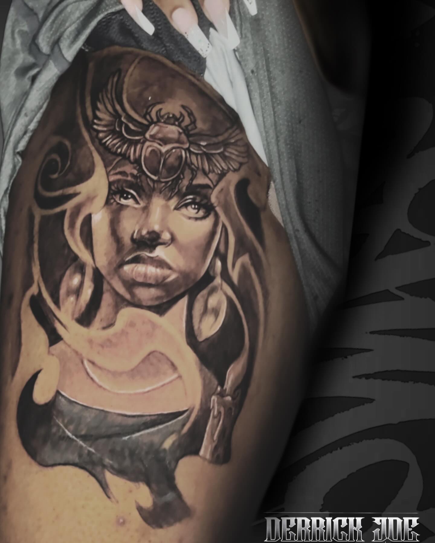 Woman with wings realism tattoo on the forearm by Derrick Joe tattoos