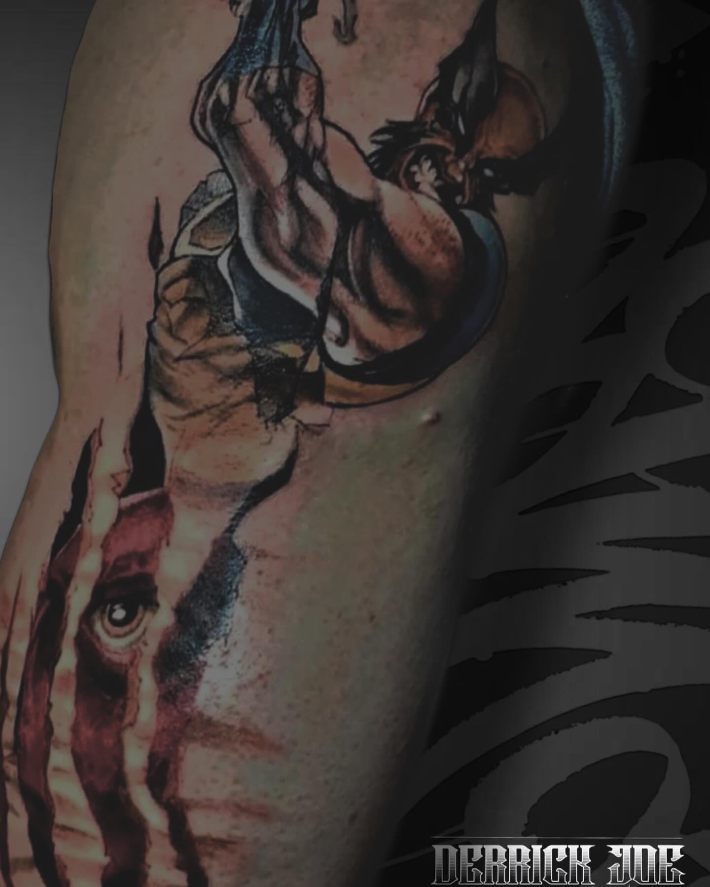 Boxing match realism tattoo on the upper arm by Derrick Joe tattoos