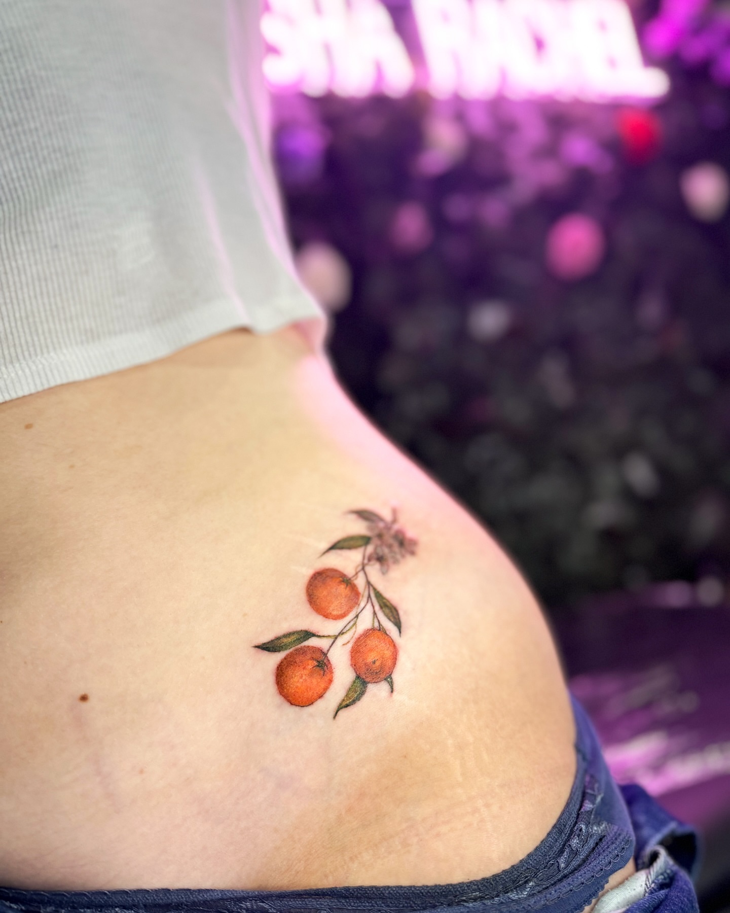 Orange cluster realism tattoo on the ribs by Natasha Rachel Fineline Tattoos Nashville