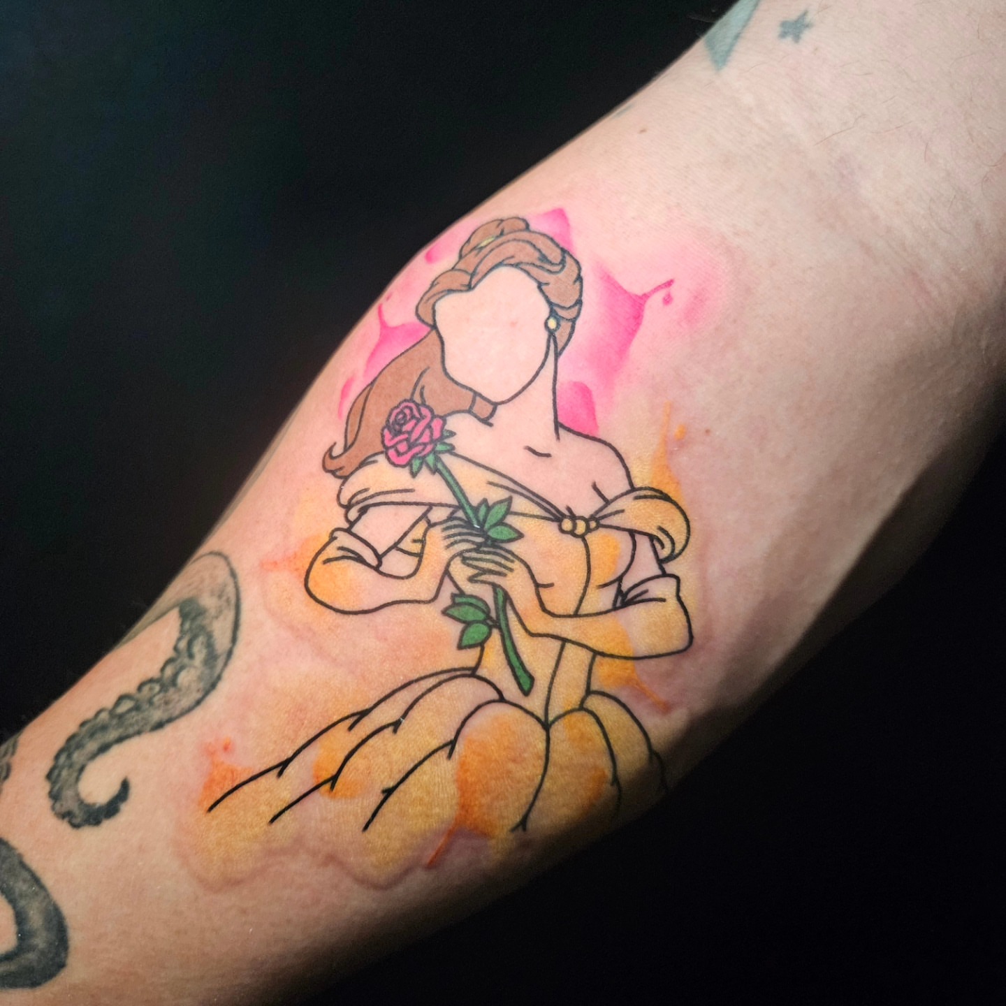 Beauty and the beast watercolor tattoo on the forearm by Nicole Bett