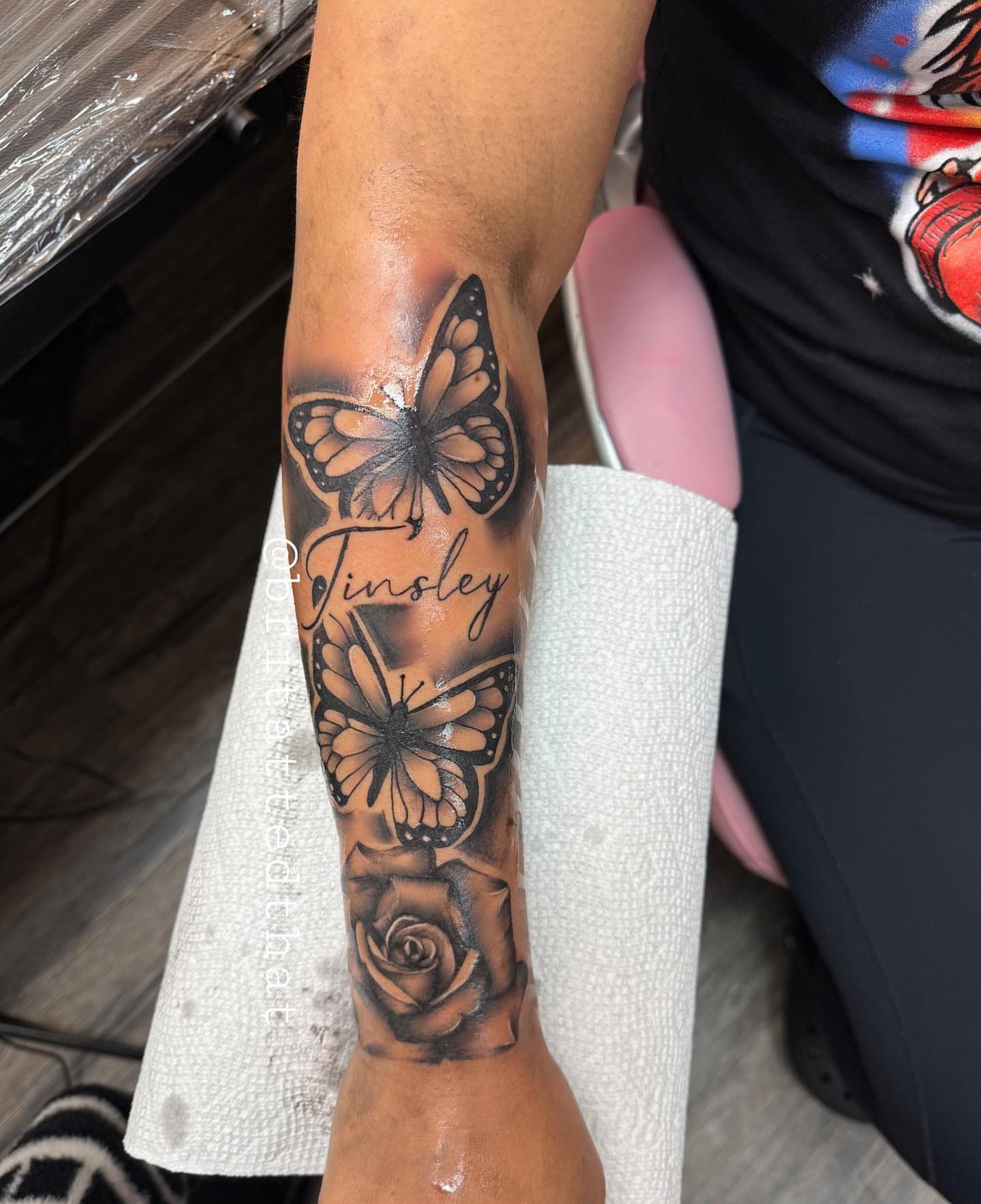 Butterfly and rose realism tattoo on the forearm by Bri Tatted That
