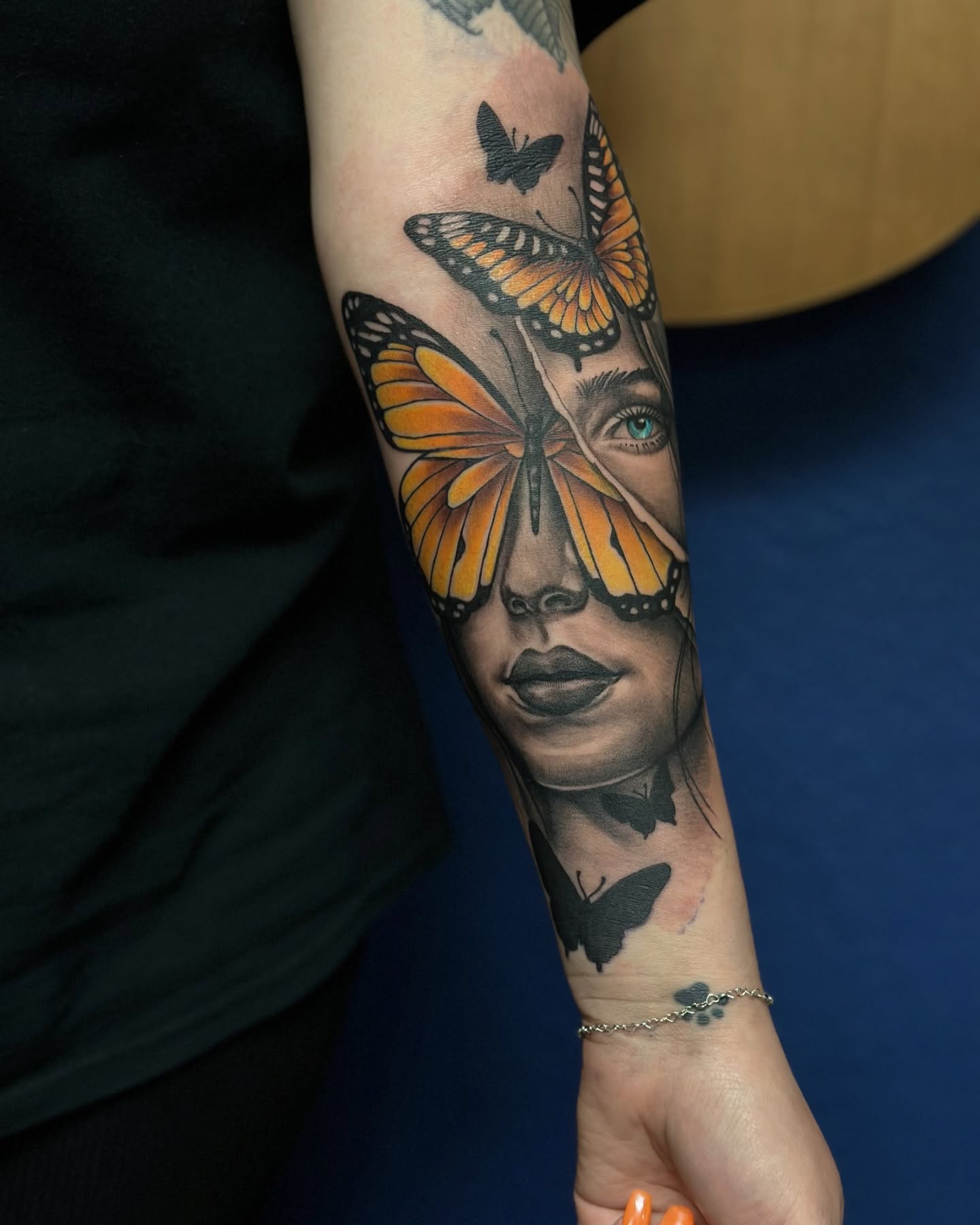 Woman's face with butterflies realism tattoo on the forearm by Calvin Maryland 🇵🇹