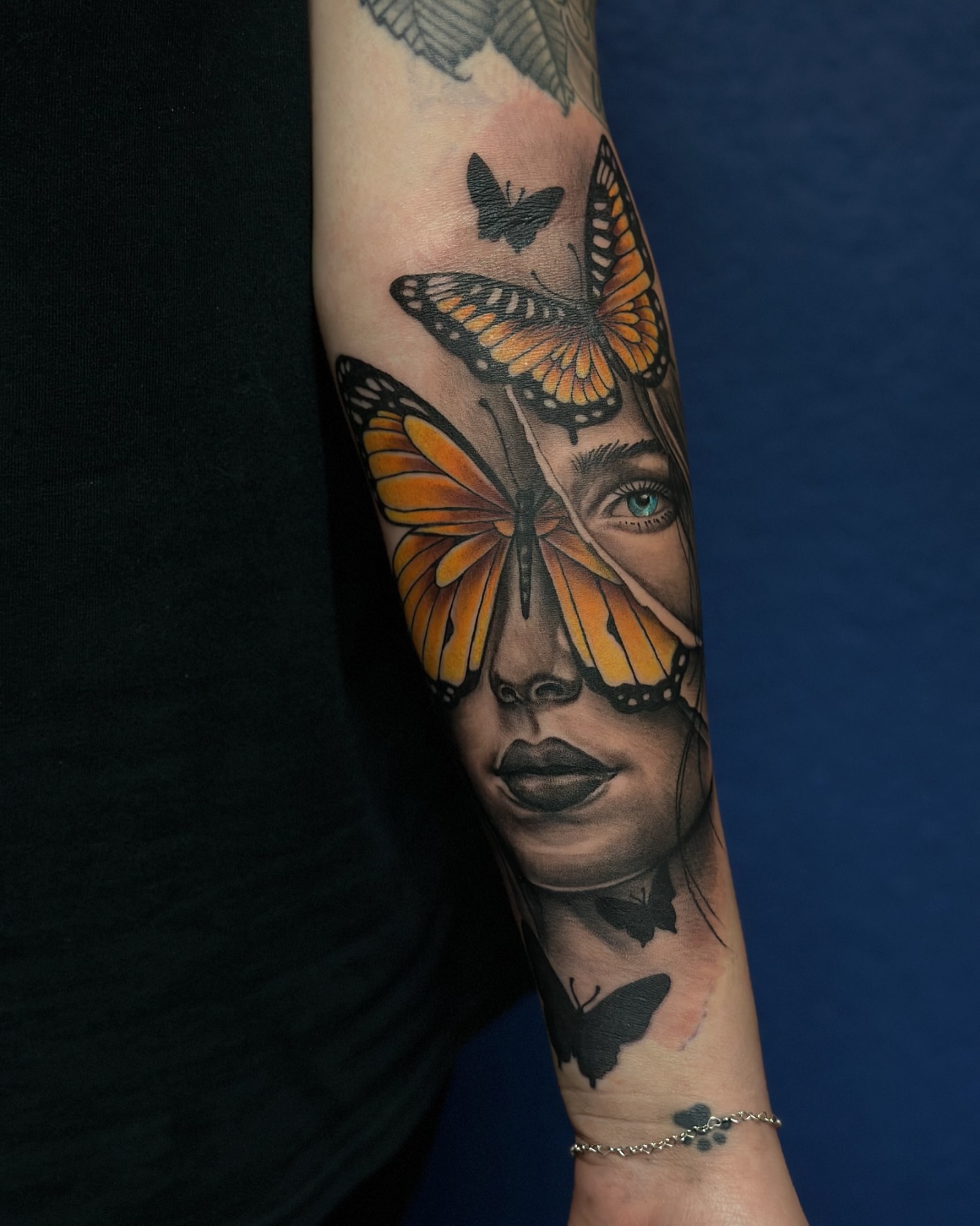 Woman's face with butterflies realism tattoo on the forearm by Calvin Maryland 🇵🇹