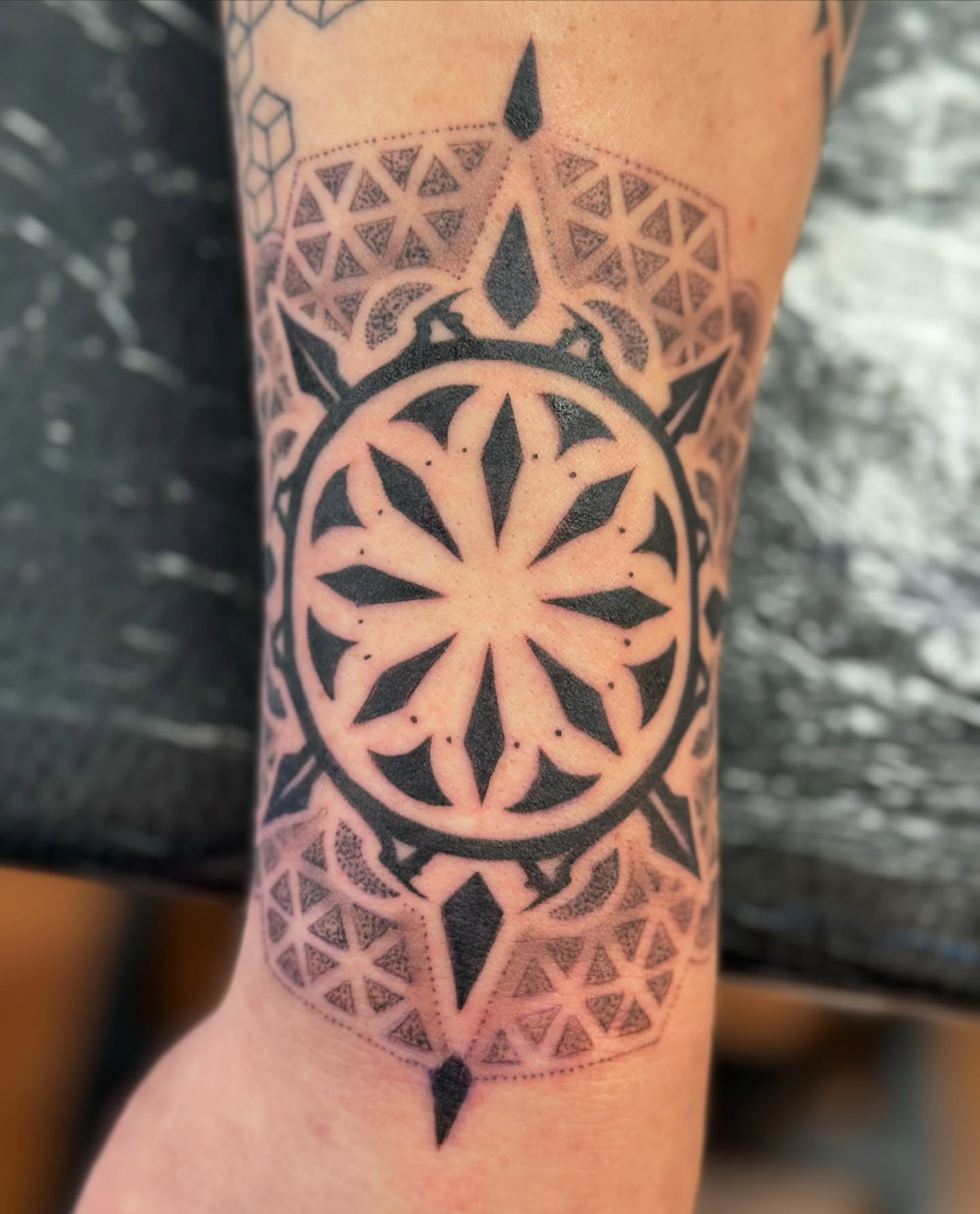 Geometric mandala geometric tattoo on the forearm by Hori Shit