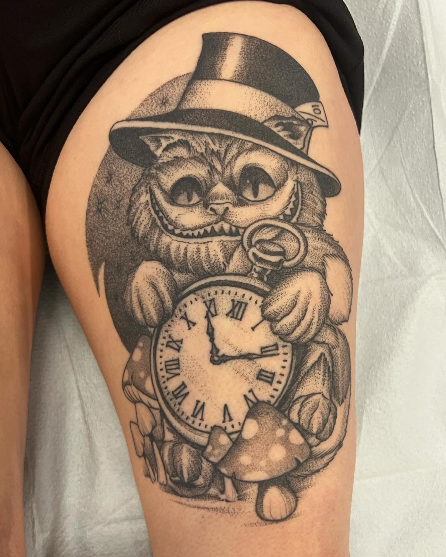 Cheshire cat dotwork tattoo on the thigh by Will Campbell