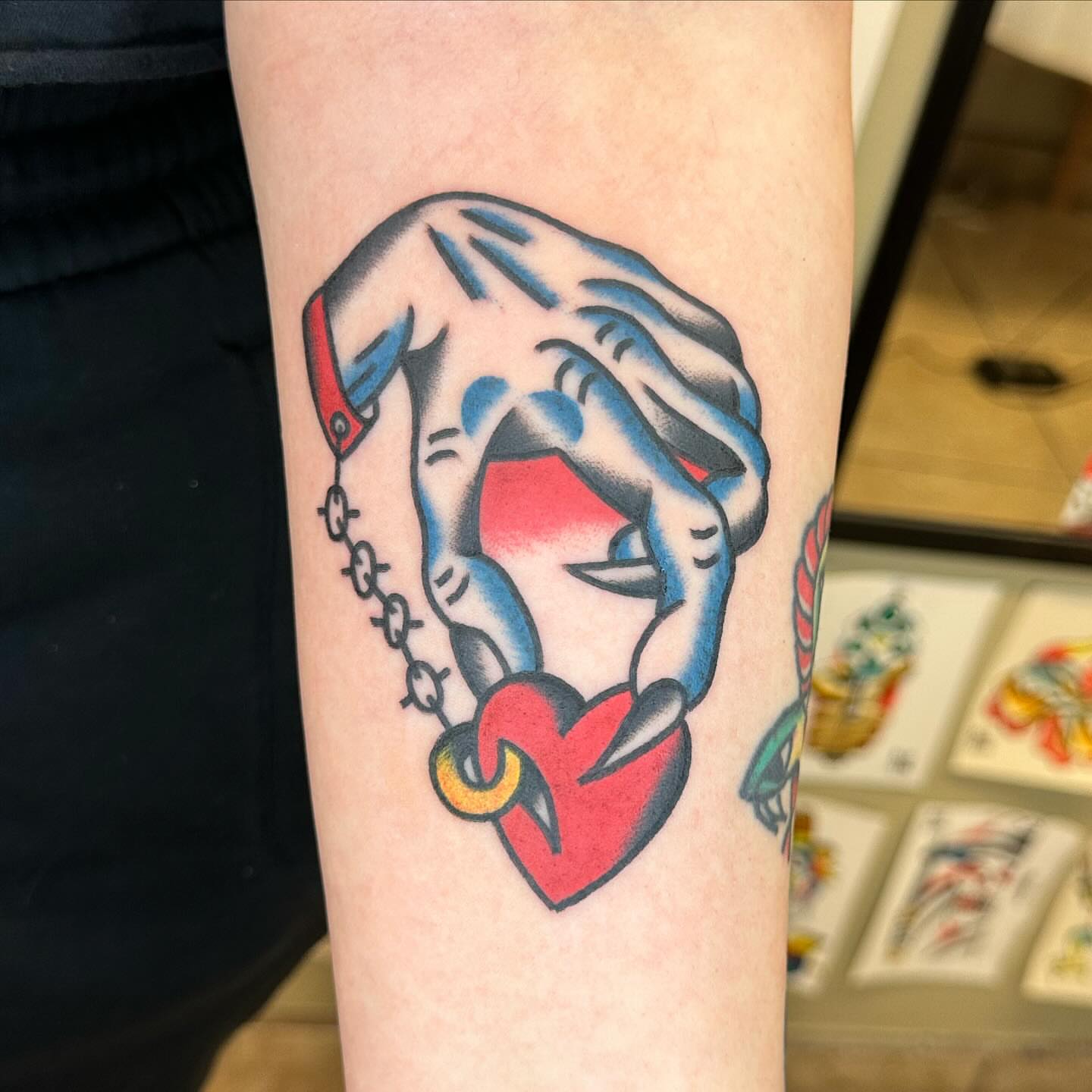 Heart and hands American traditional tattoo on the forearm by Keon Ostby, Tempe, Arizona