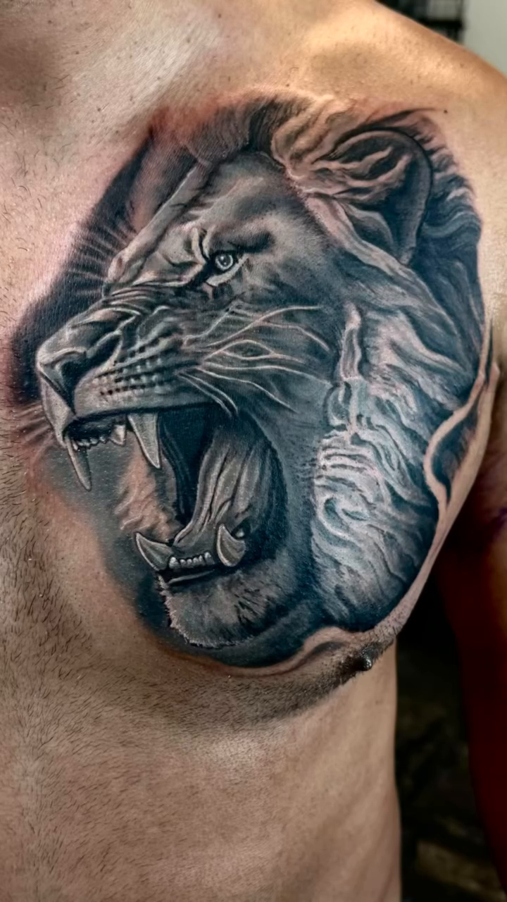 Lion's head realism tattoo by Michael Tovar